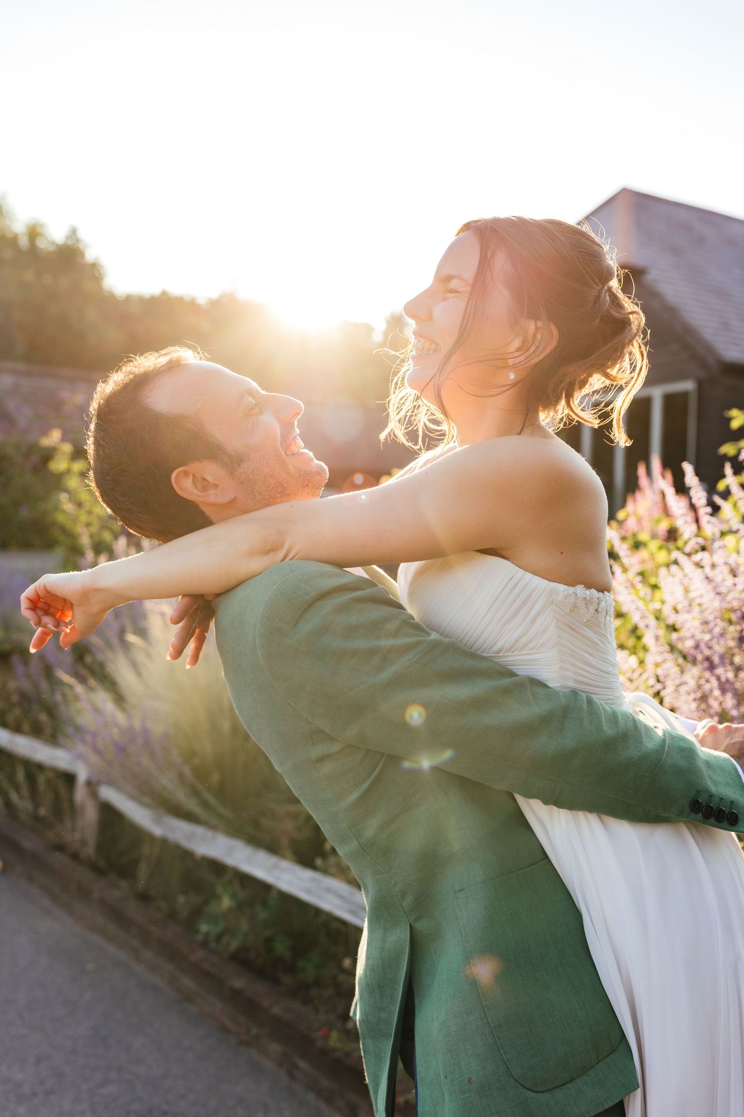 Golden hour couple portrait at Kimbridge Barn, relaxed barn wedding photography with natural light