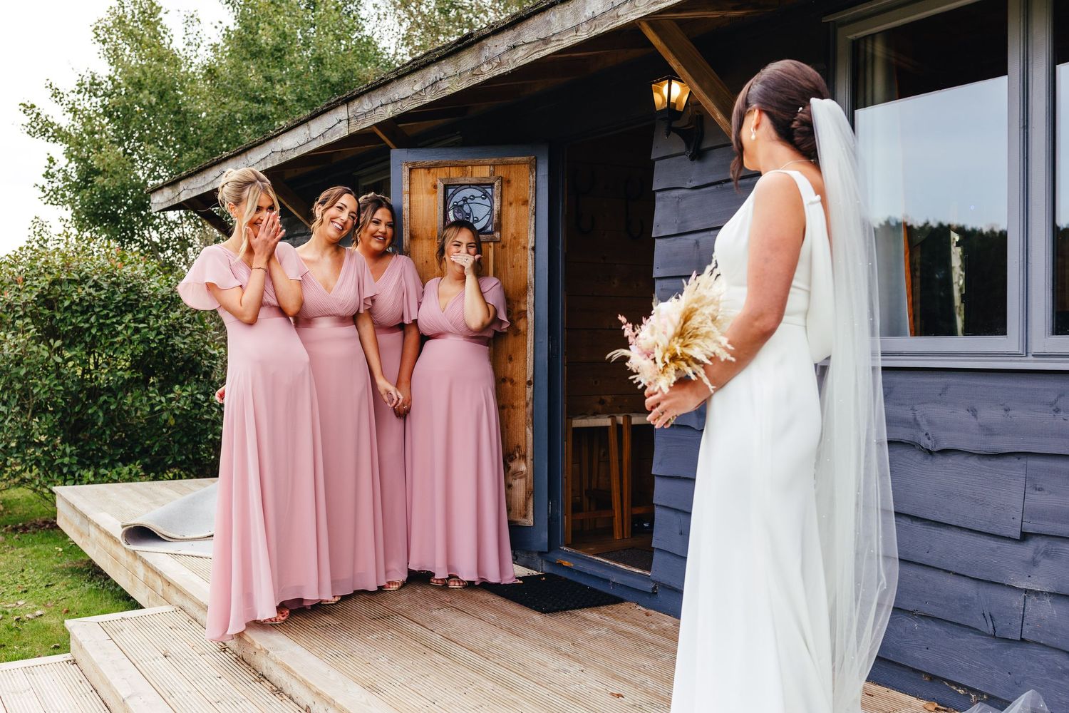 Bridesmaids seeing bride at Inkersall Grange Farm Derbyshire, relaxed barn wedding photography