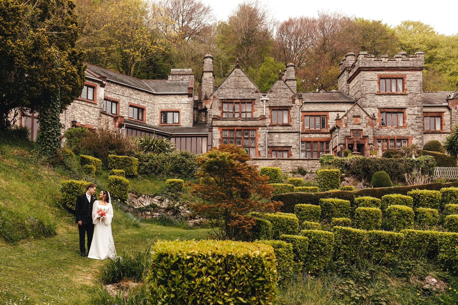 Bride and groom in the gardens at Netherwood Hotel & Spa, Lake District wedding photography