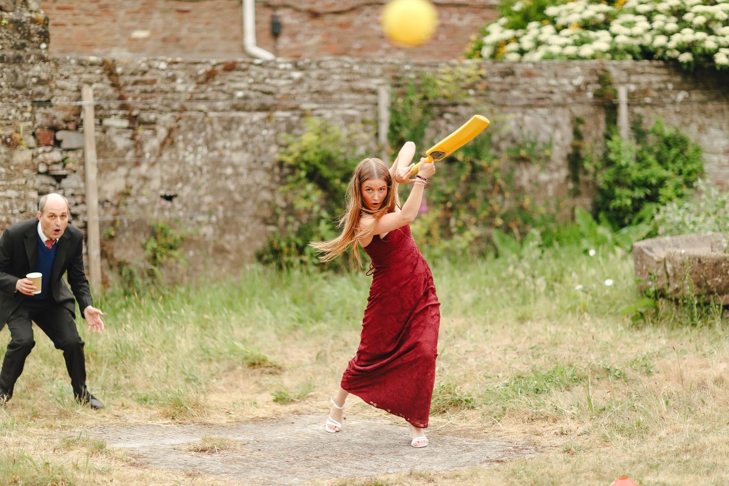 Candid wedding guest moment at Winterbourne Medieval Barn in Bristol