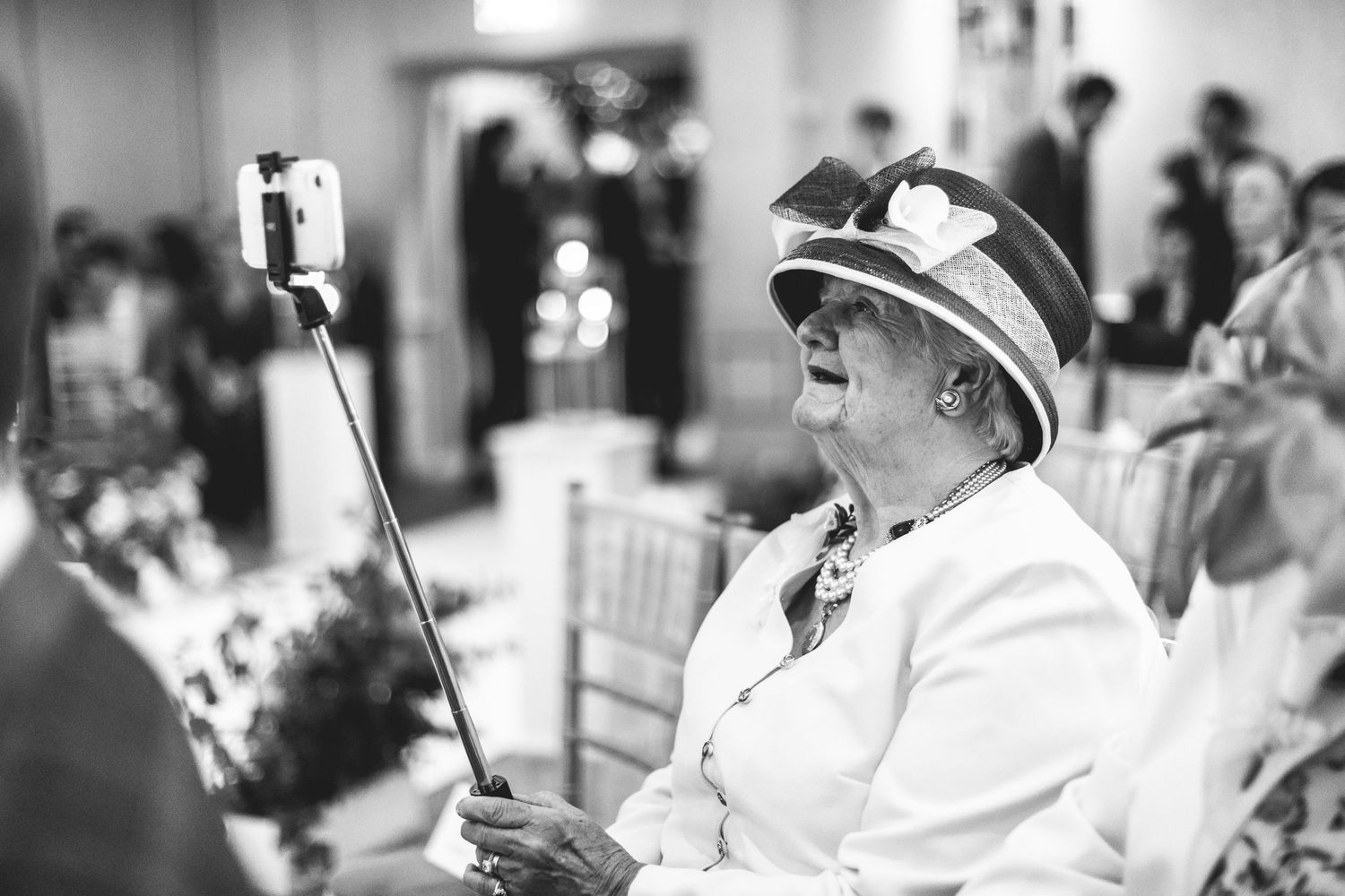Black and white candid guest portrait at Derbyshire wedding, documentary wedding photography