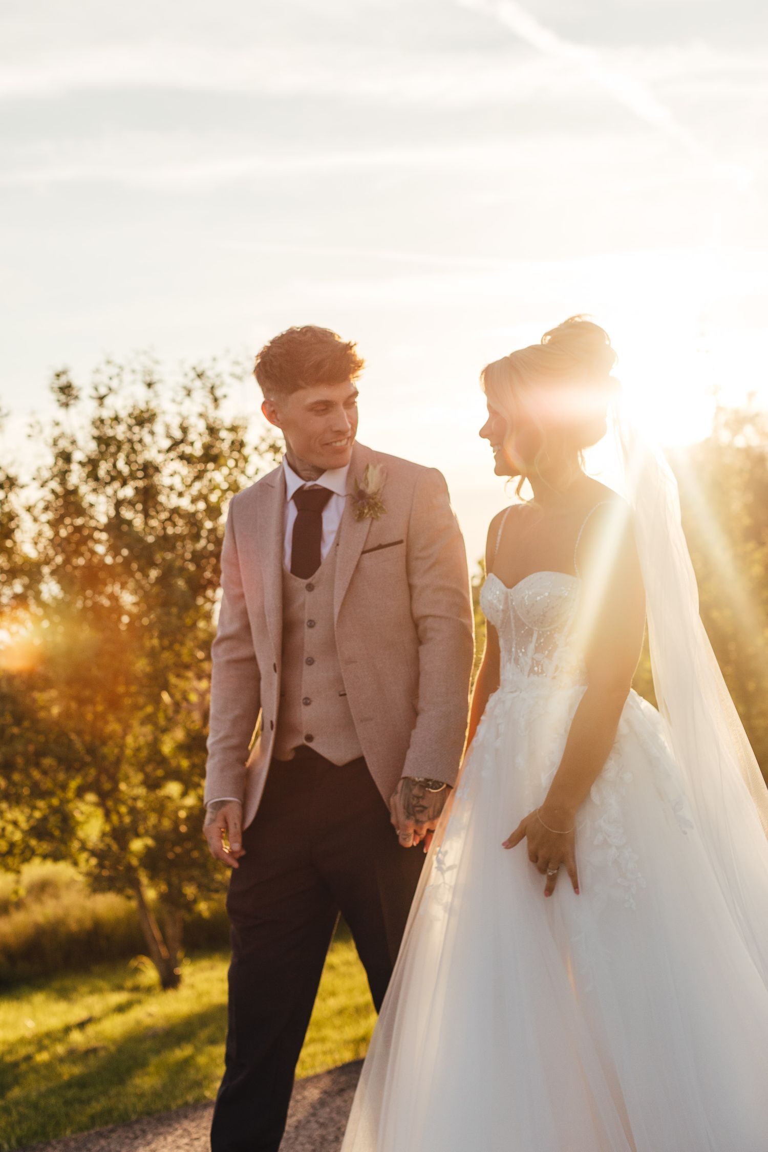 Grangefields wedding photography Derbyshire, bride and groom walking at golden hour during summer barn wedding