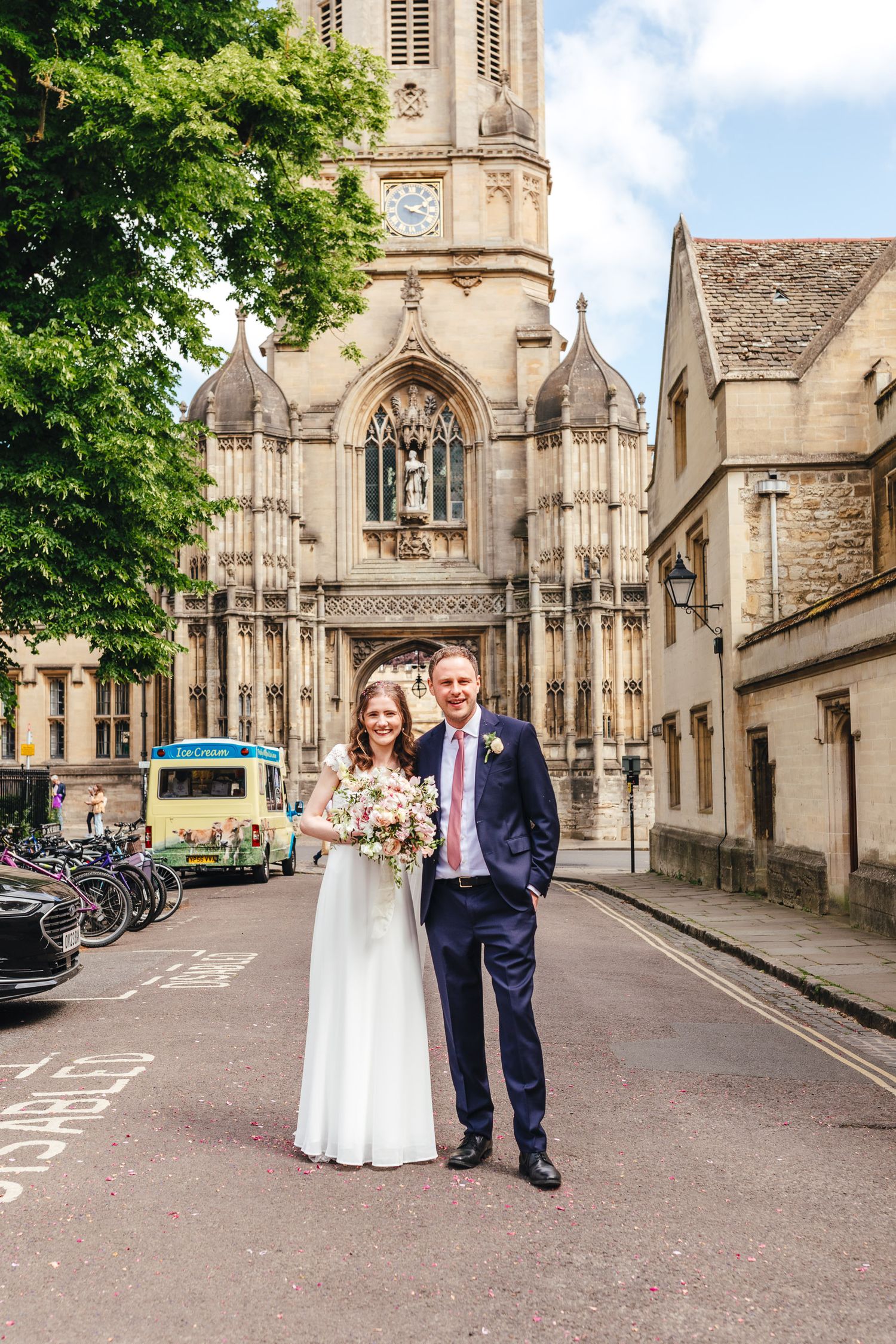 Bride and groom portrait in Oxford city centre streets, elegant summer wedding photography