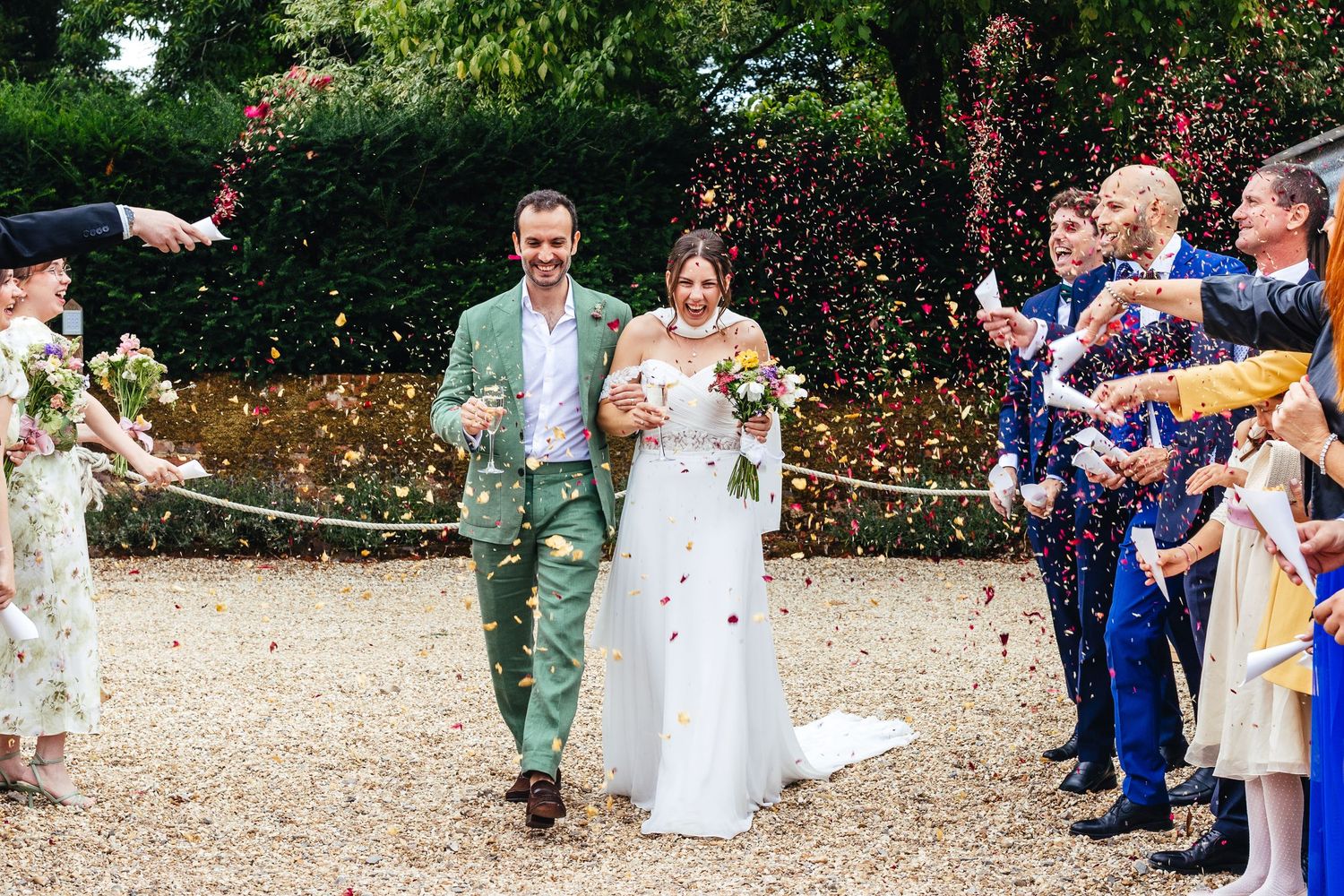 Confetti moment at Kimbridge Barn wedding, joyful candid barn wedding photography