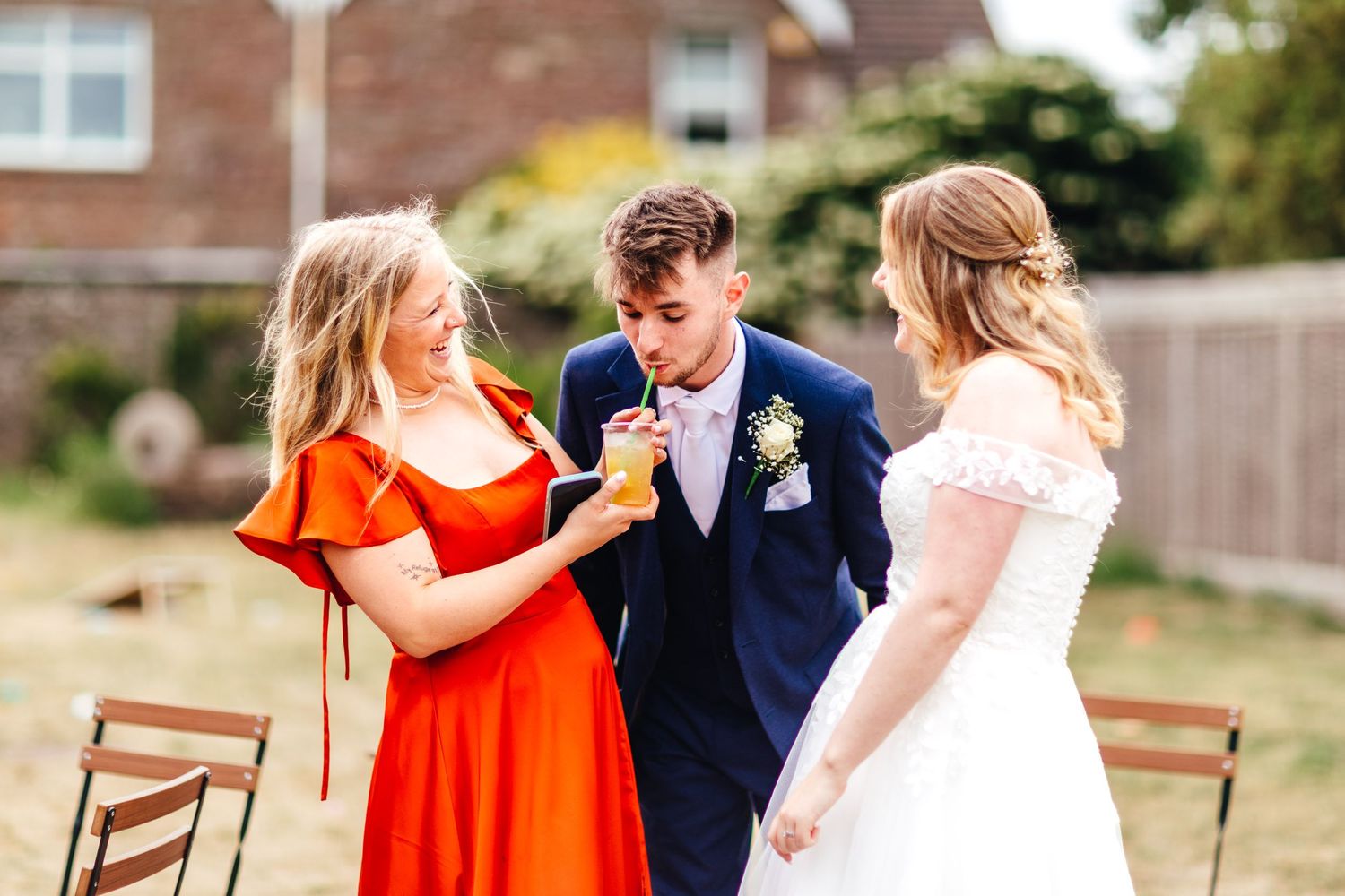 Candid wedding guest moment at Winterbourne Medieval Barn in Bristol