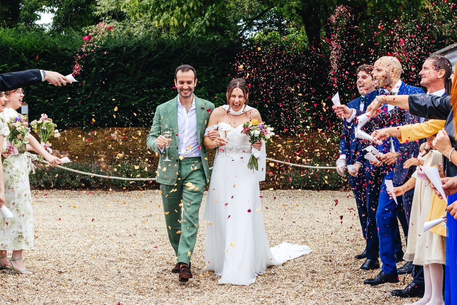 Confetti exit at Kimbridge Barn Romsey, natural documentary wedding photography