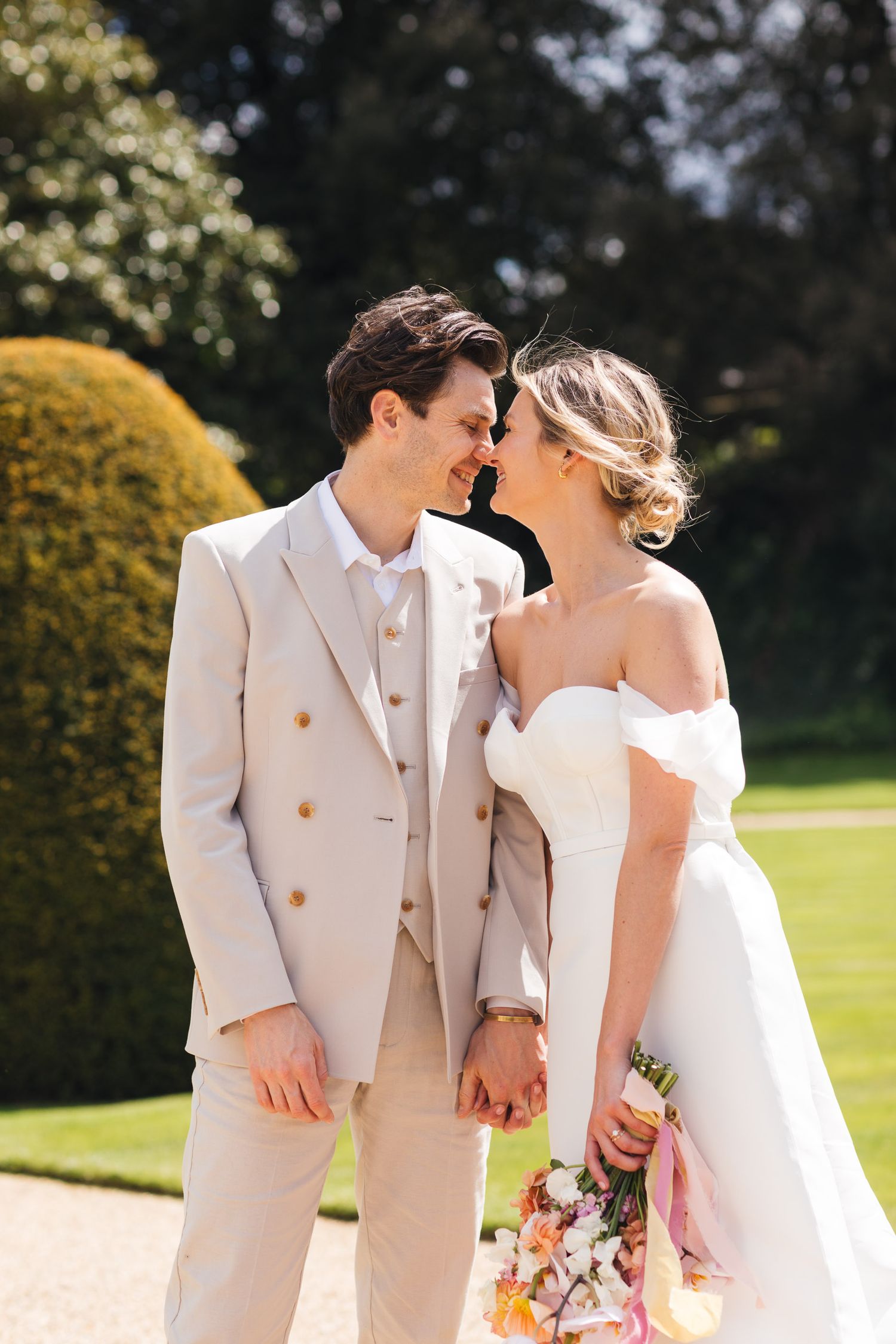 Couple portrait at Syon Park London, stylish spring wedding photography with natural light and garden backdrop