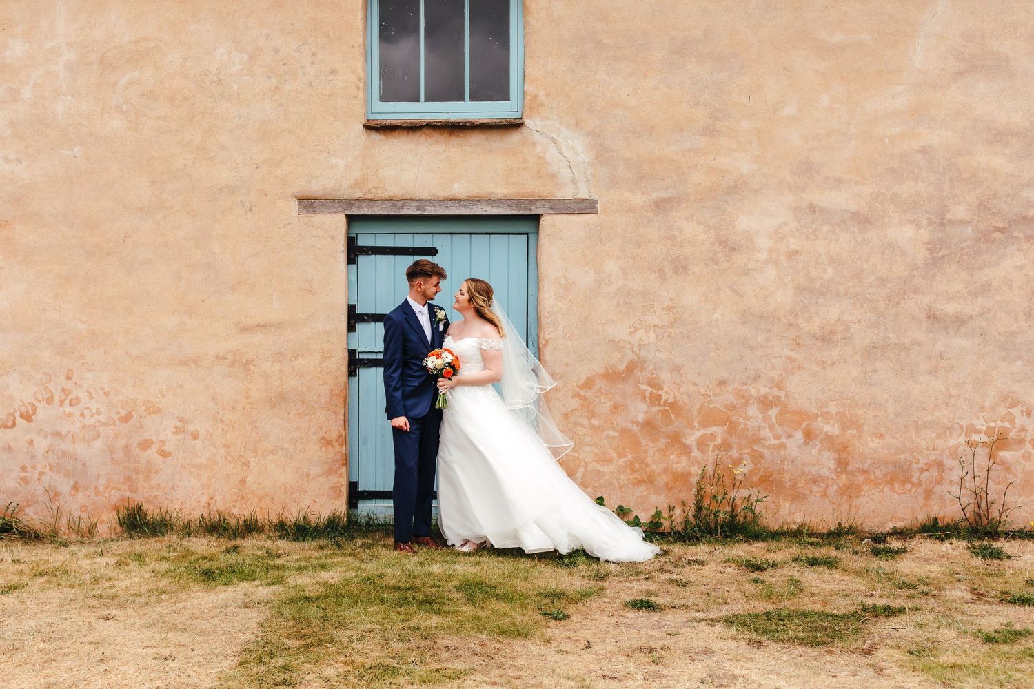 Bride and groom portrait outside Winterbourne Medieval Barn in Bristol