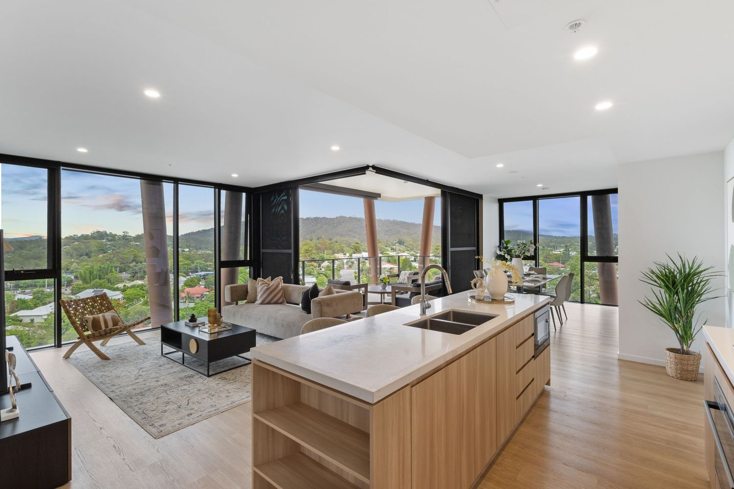 Spacious living area with panoramic windows offering stunning mountain views.