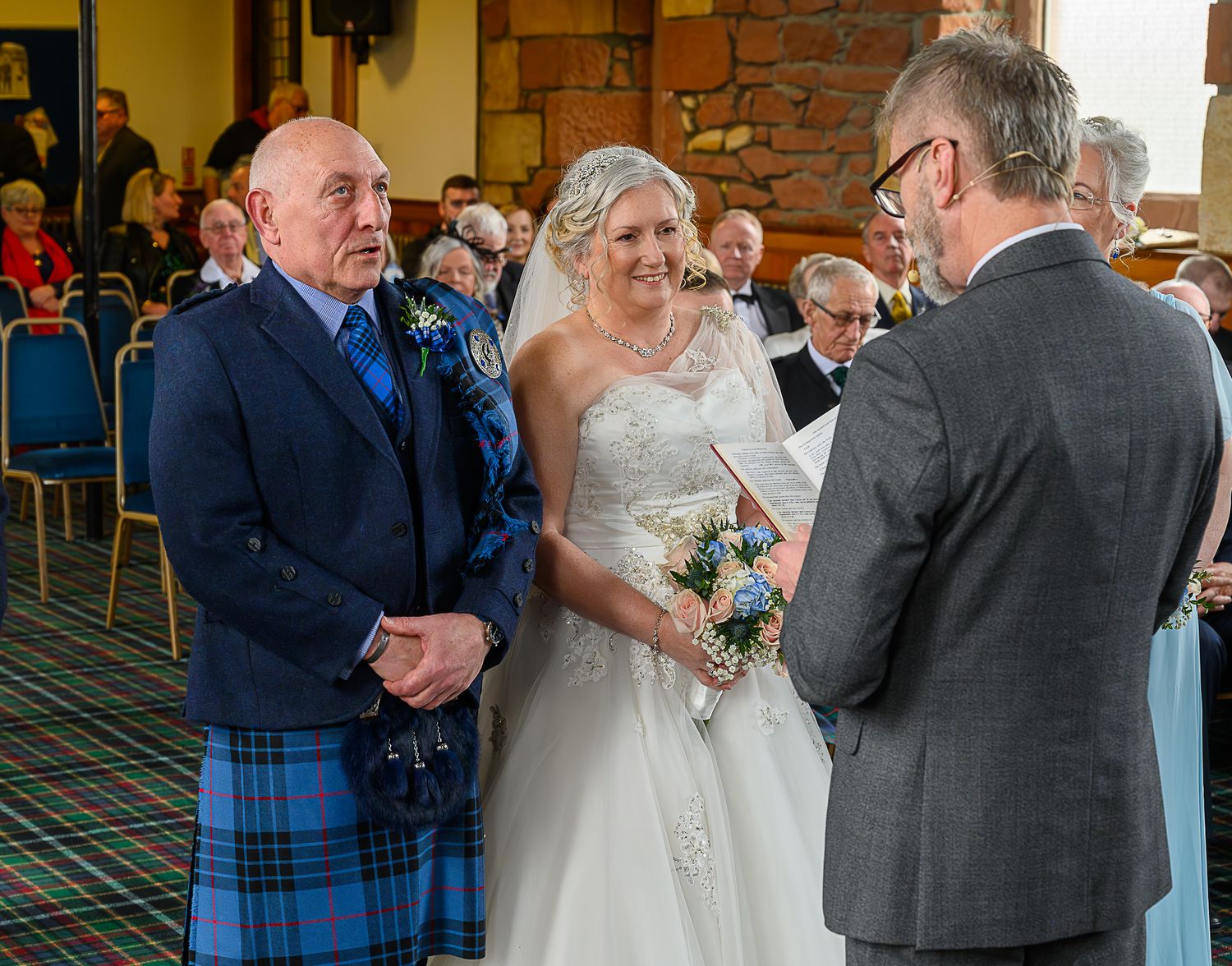 Wedding ceremony moment captured indoors with brick wall and formal attire visible in sequence of photographs.