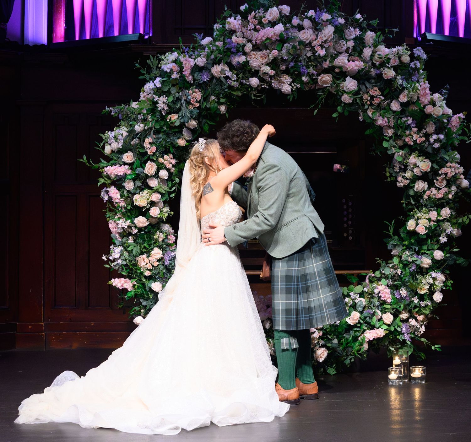 Aye fond kiss -  St Jude's and the Winged Ox in Glasgow.  Glasgow Wedding Photographer