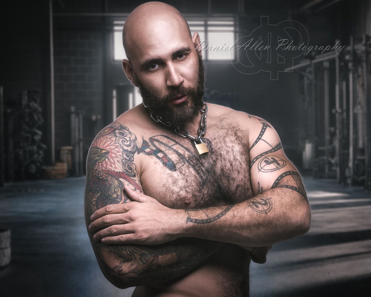 Artistic black and white portrait series showcasing dramatic lighting and shadows against an industrial backdrop.
