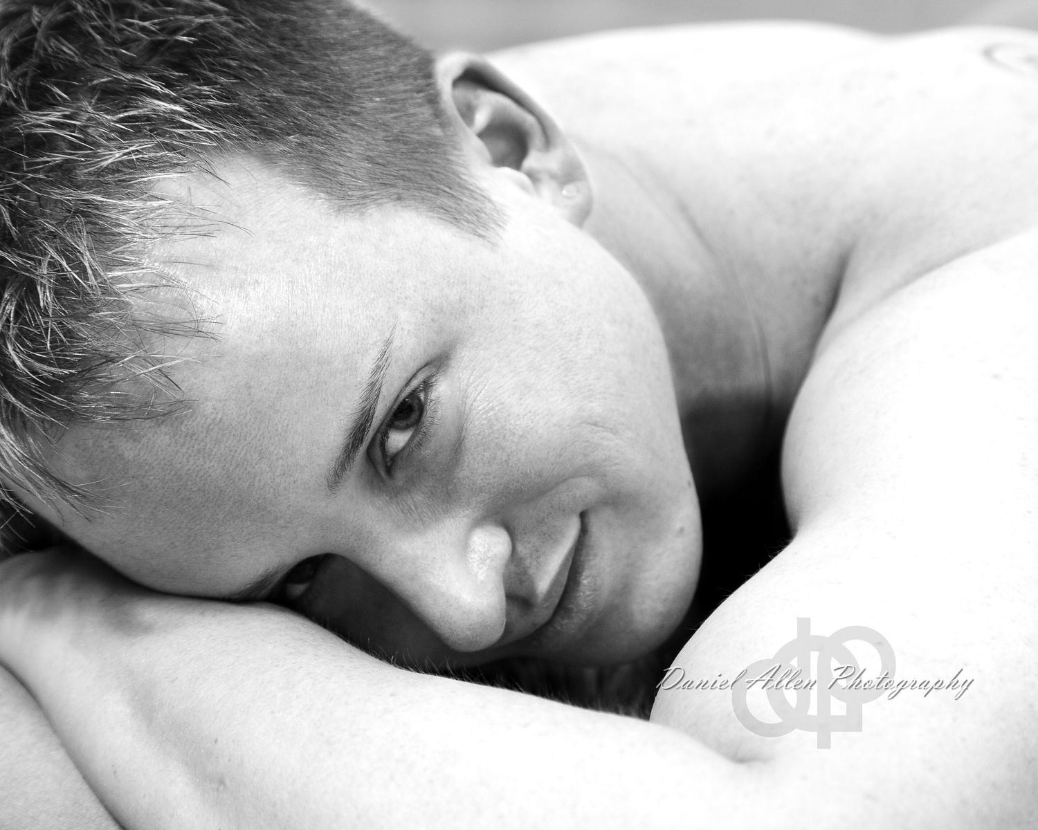 A black and white artistic photo series showing a person resting peacefully on white bedding.
