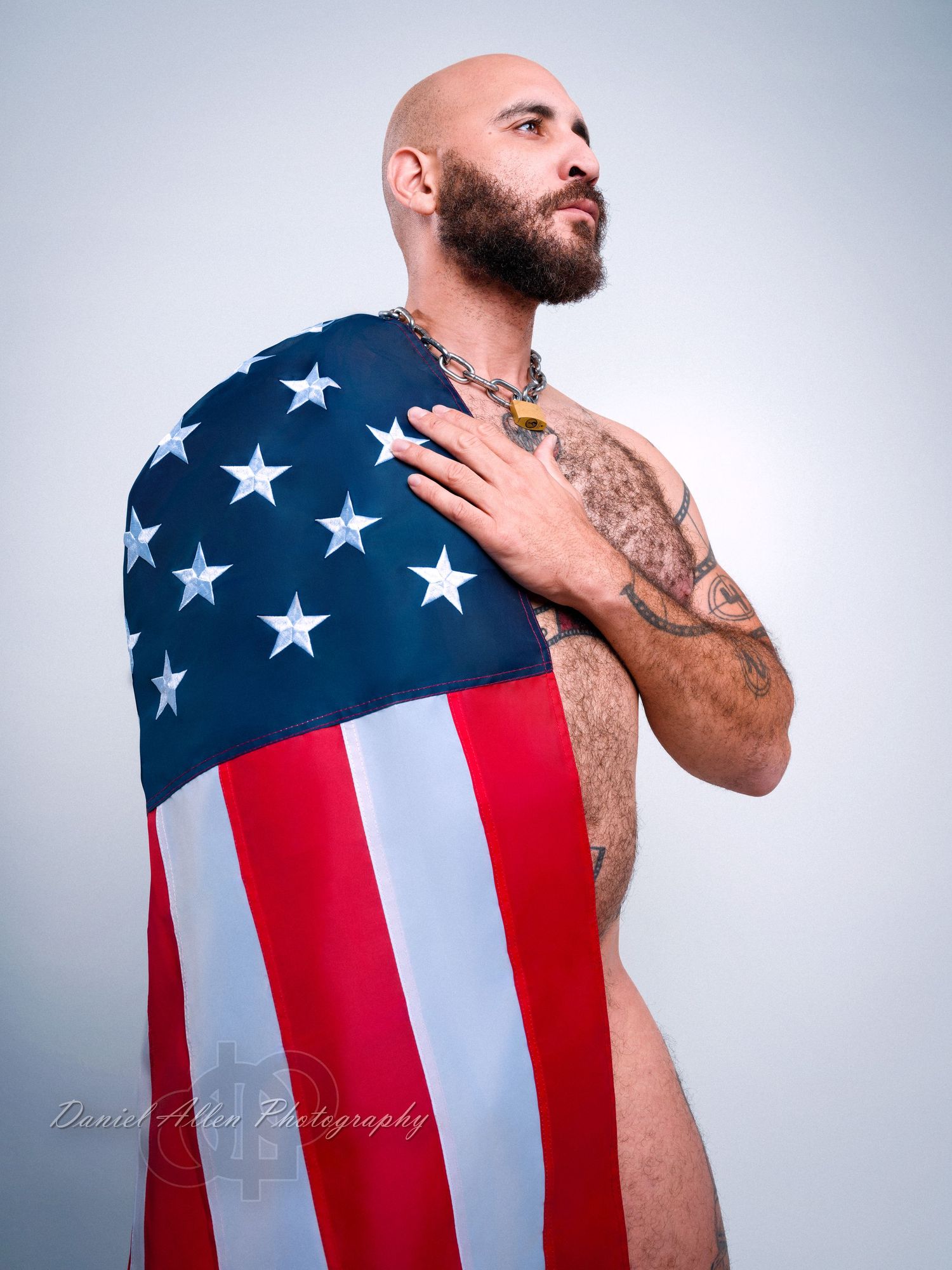 Artistic portrait series featuring American flag draped against light studio background.