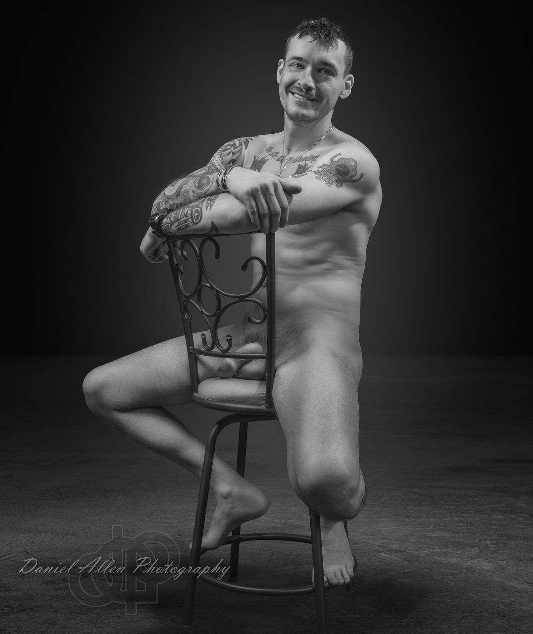 Monochrome studio photography featuring minimalist chair composition.