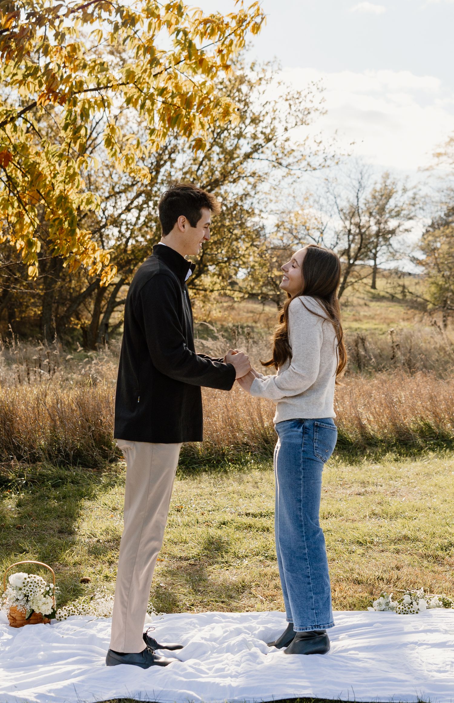 Sequence of a surprise proposal on a picnic blanket during golden hour in autumn.