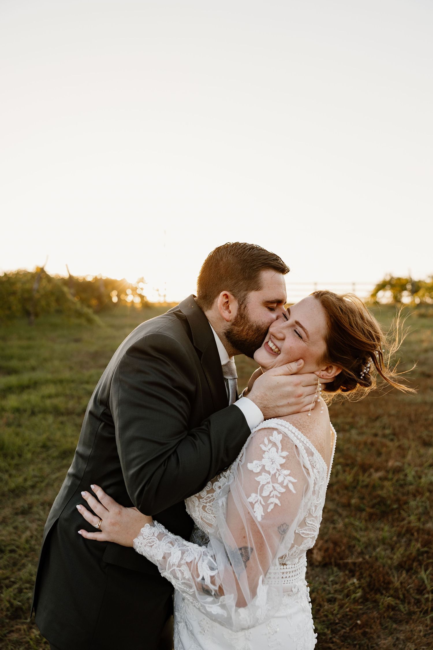 Romantic sunset wedding photos in a natural outdoor setting.
