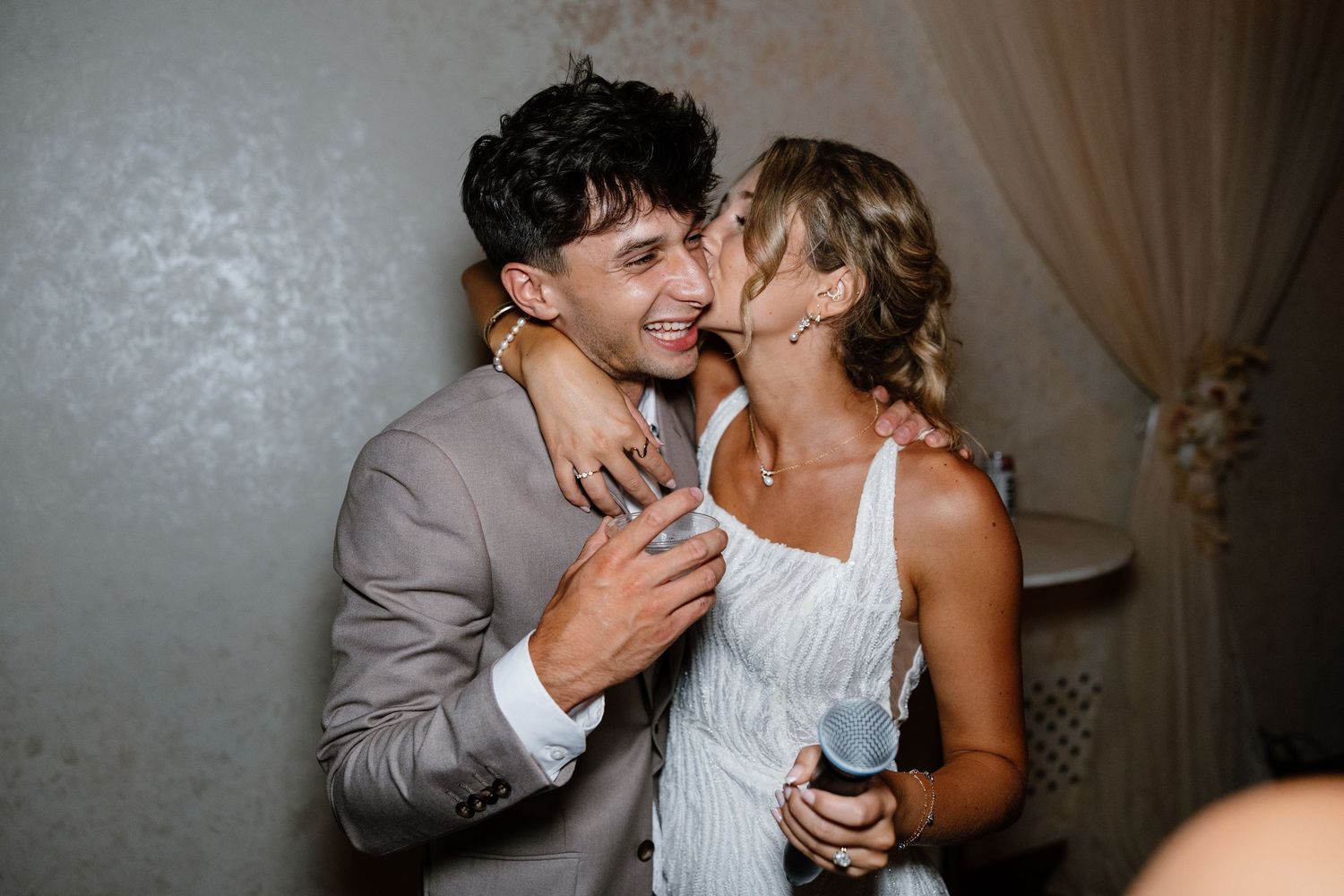 Wedding couple sharing intimate moments during reception in dimly lit venue in downtown omaha