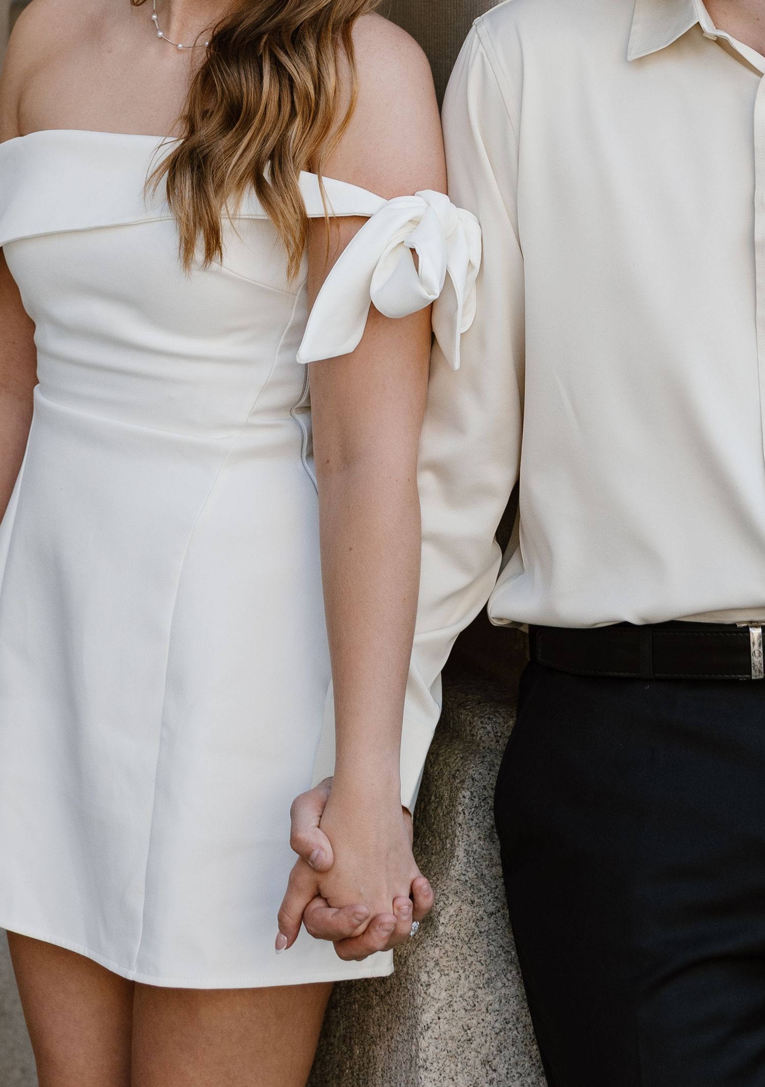 Minimalist fashion details showing white and black formal attire.