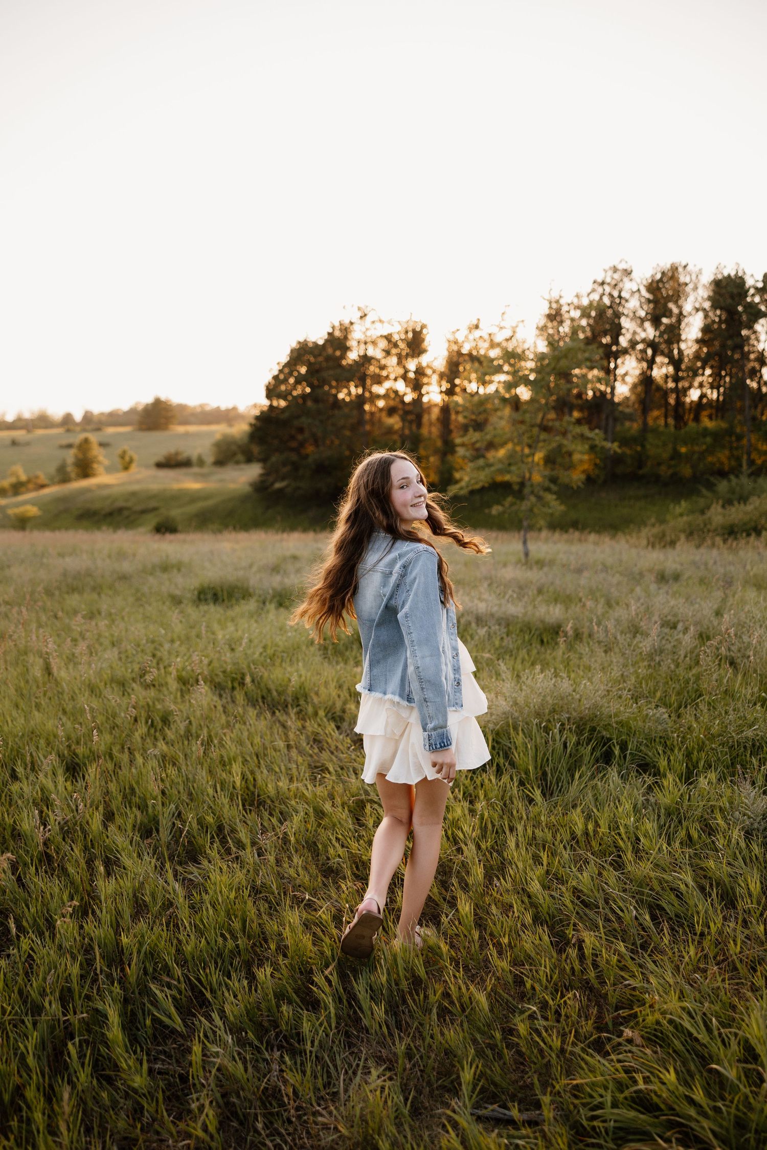 Carefree movement captured in a summer field during golden hour.
