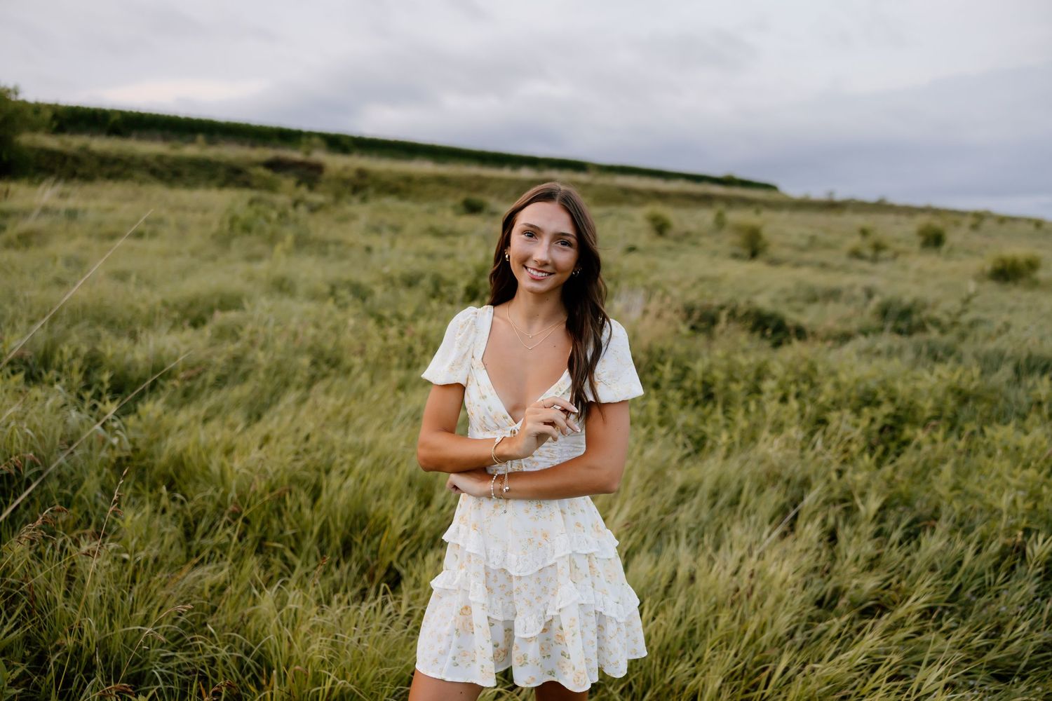 A series of outdoor portrait photography shots in a grassy field at sunset.
