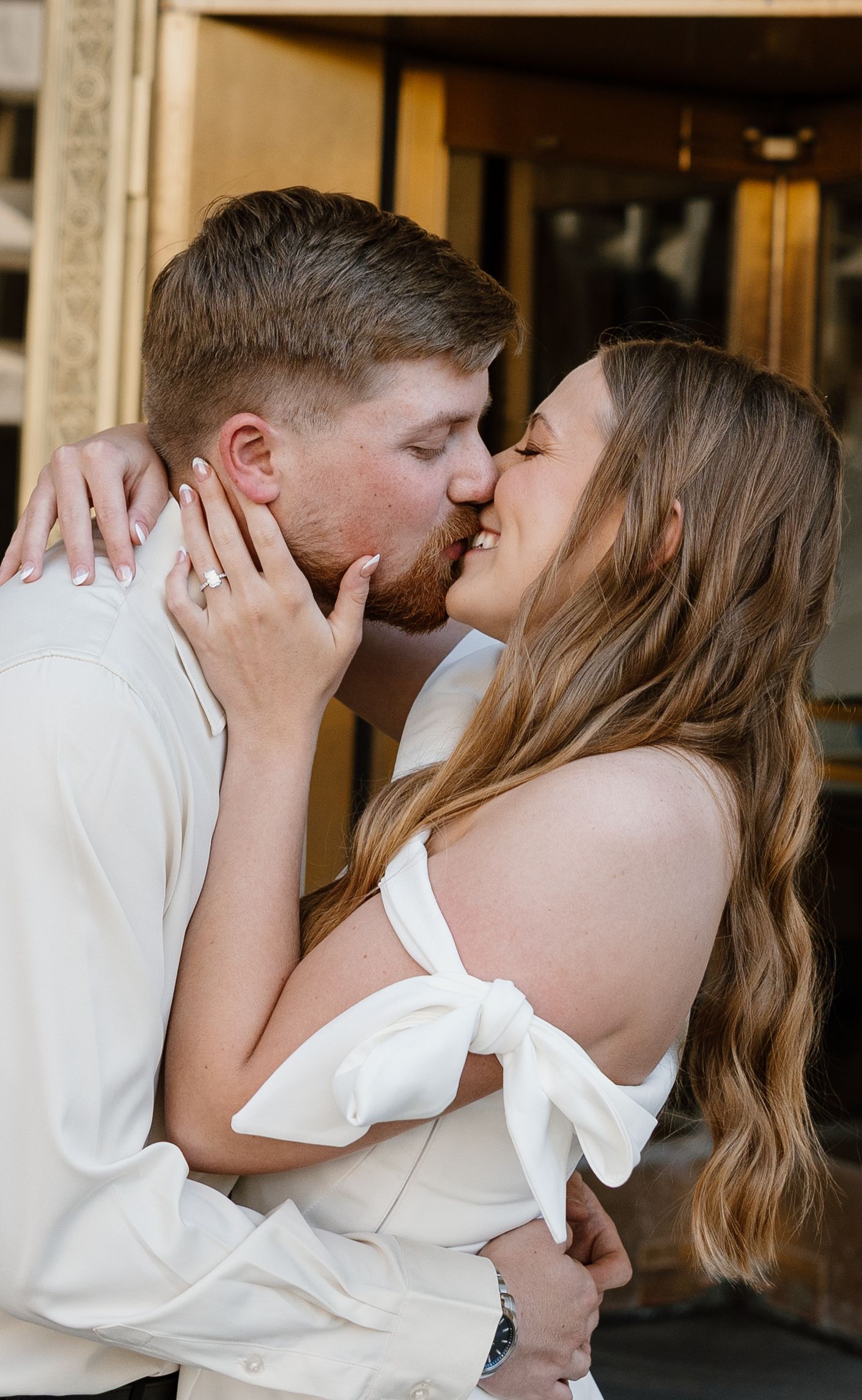 Intimate wedding portrait of couple sharing tender moment.