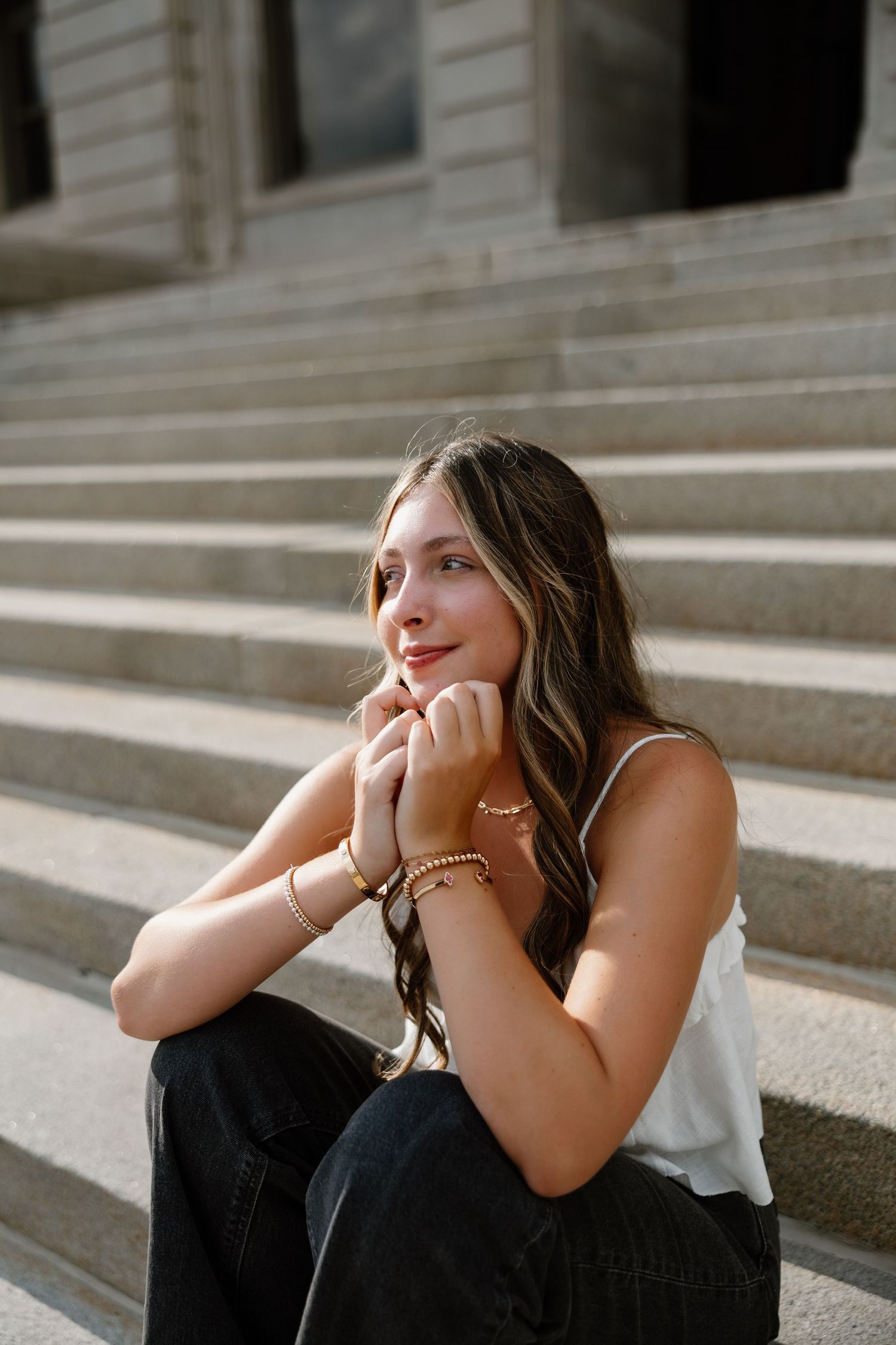 Collection of portrait shots on concrete steps in natural lighting.