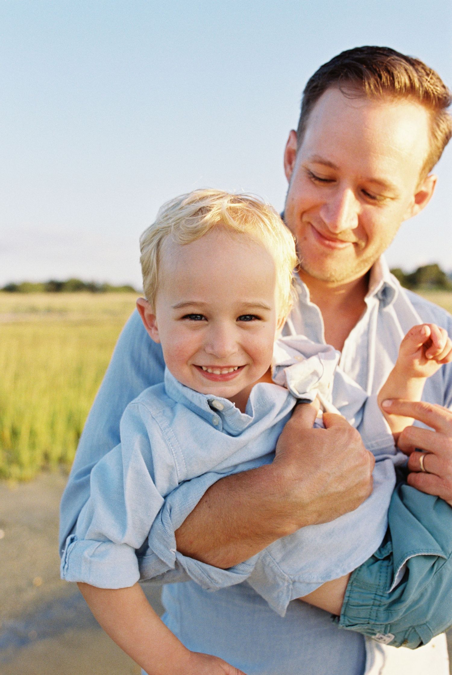 A joyful moment captured in a series of candid shots showing playful interaction in a sunny outdoor setting.