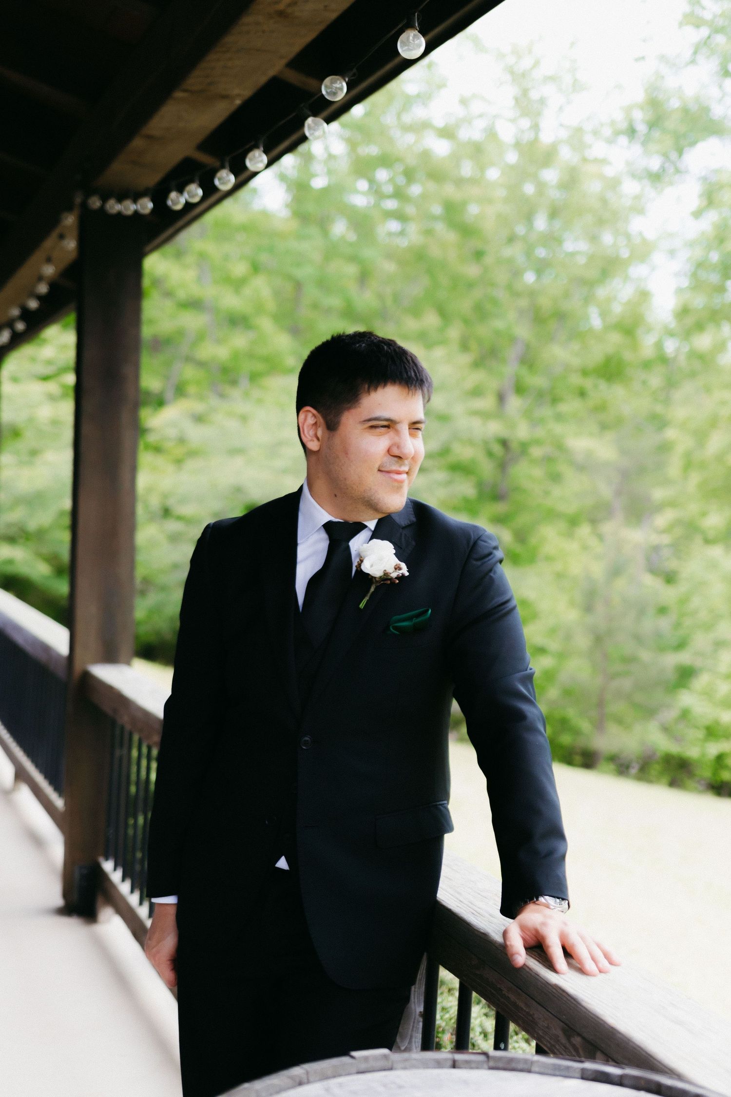 Formal portrait session taken under covered porch during wedding. Dahlonega, Georgia wedding photographer.