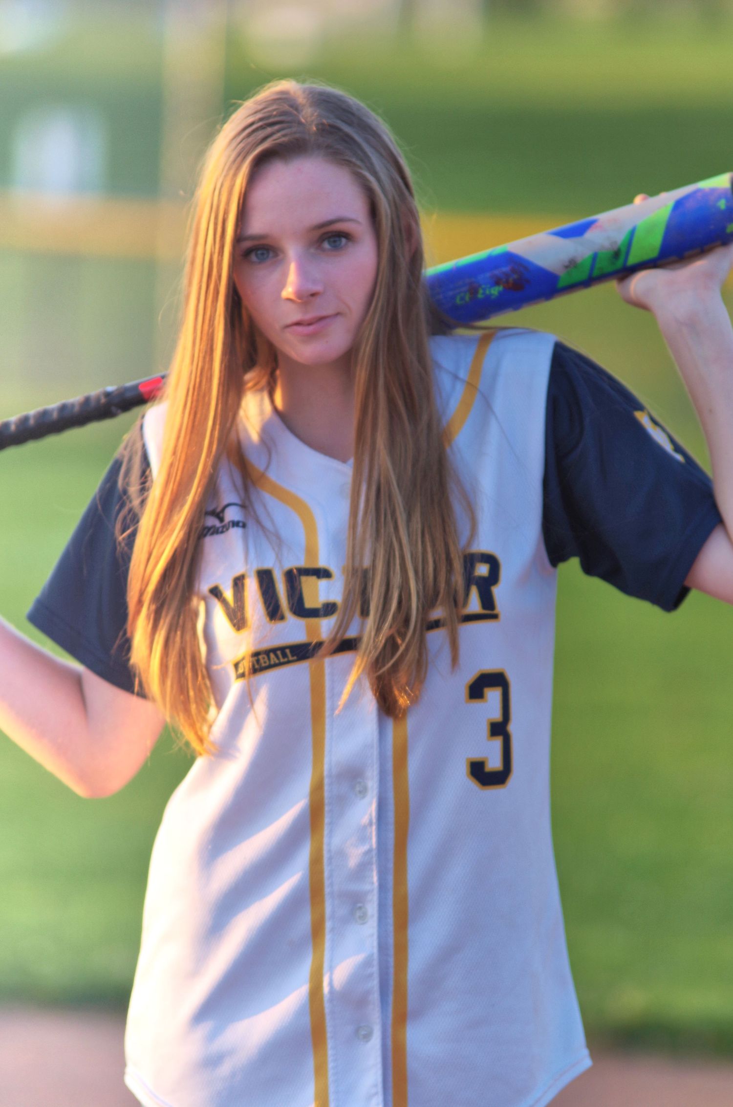 Baseball uniform portrait with number 3 jersey holding bat across shoulders.