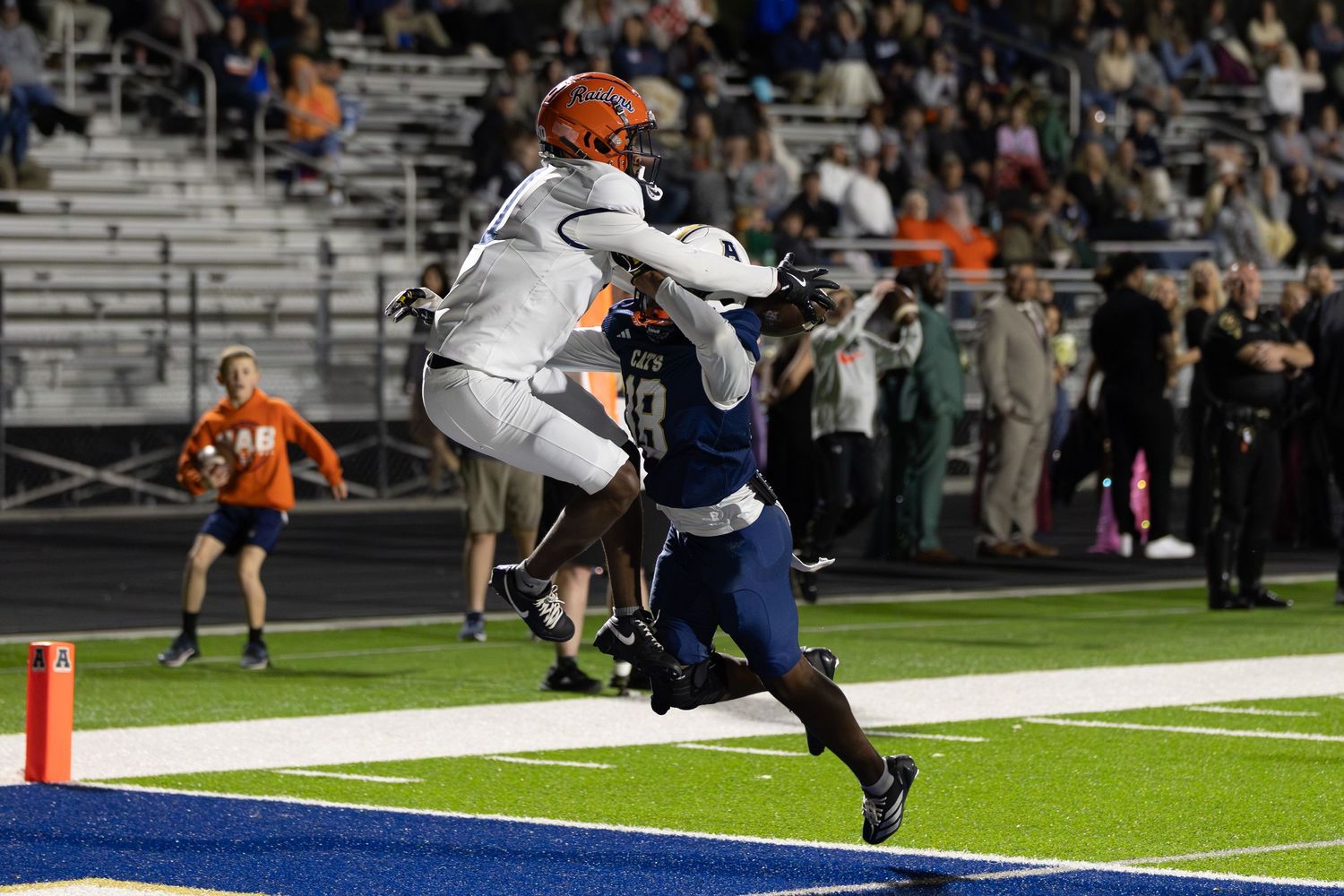 Habersham Central High School football receiver catches a touchdown pass behind a defender.