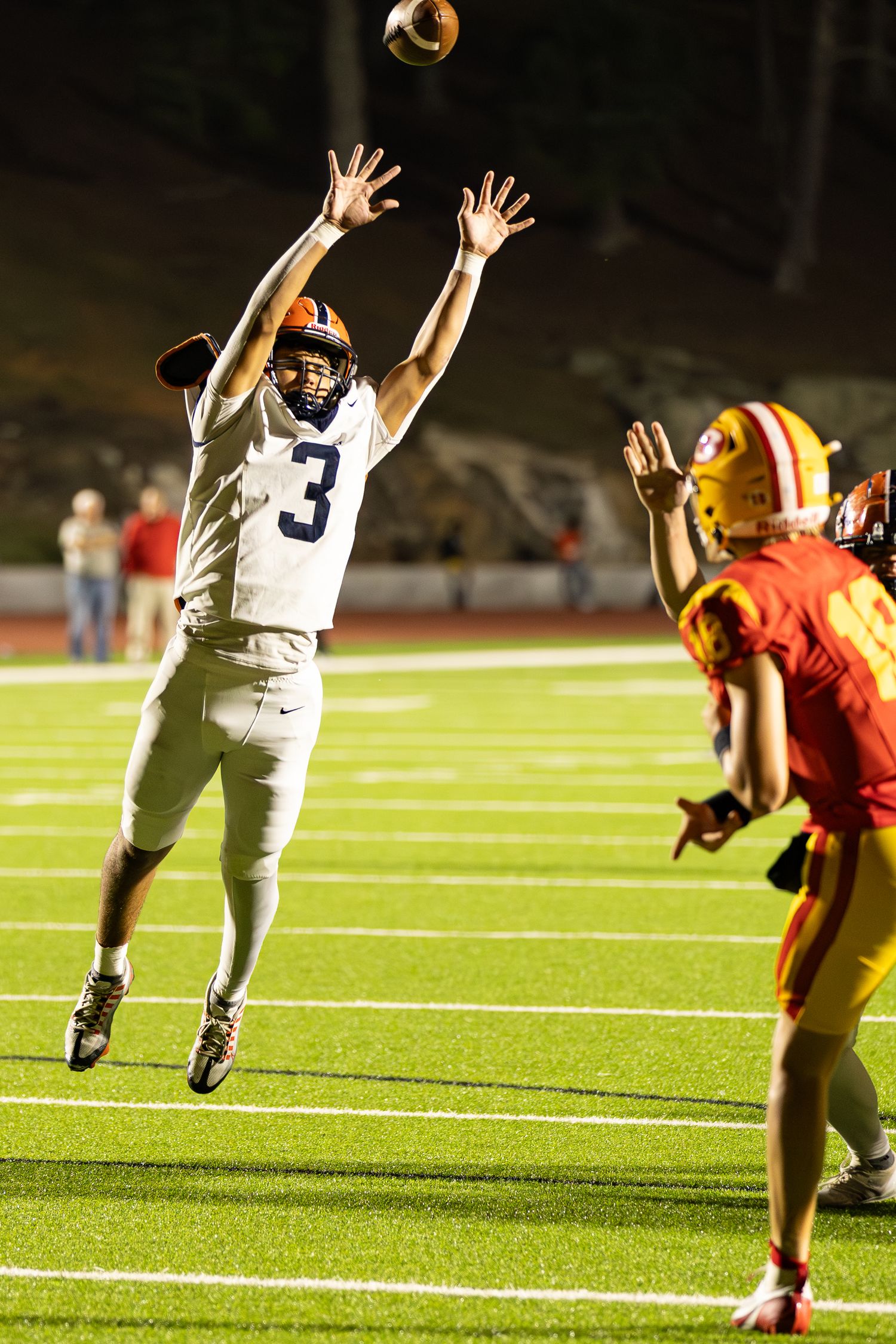 A Habersham Central defensive player tries to block a pass thrown by Clarke Central during a game played in Athens, Georgia.