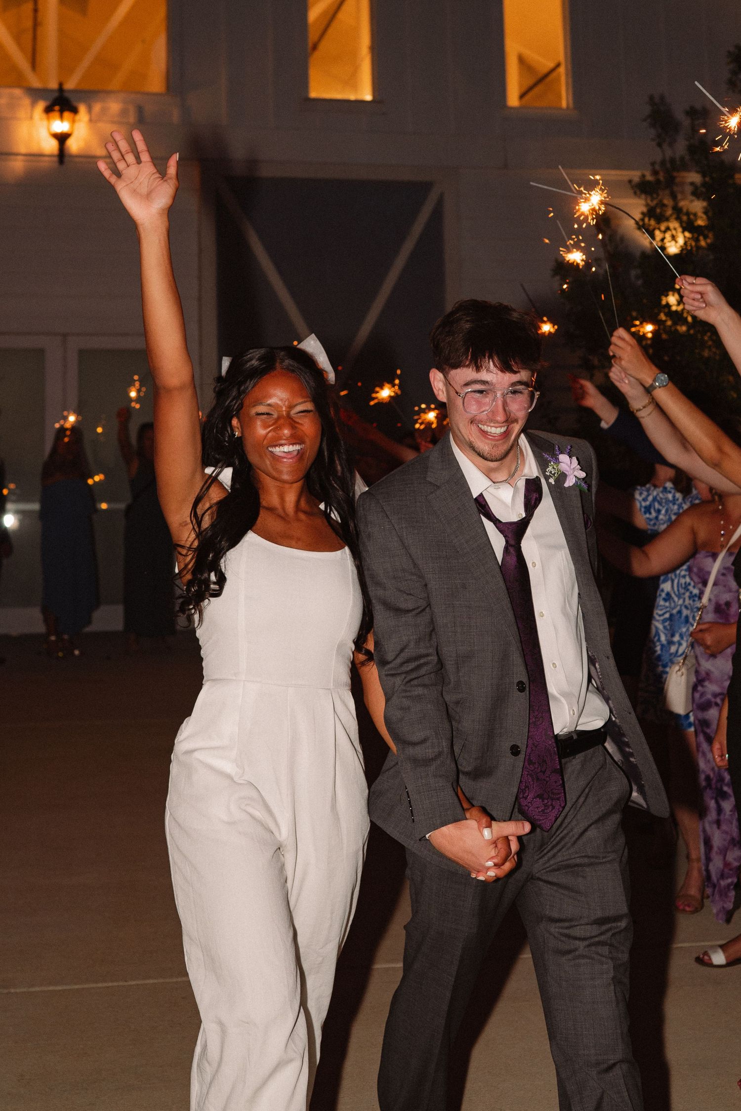 Candid wedding reception sparkler send off of married couple in DFW, Texas