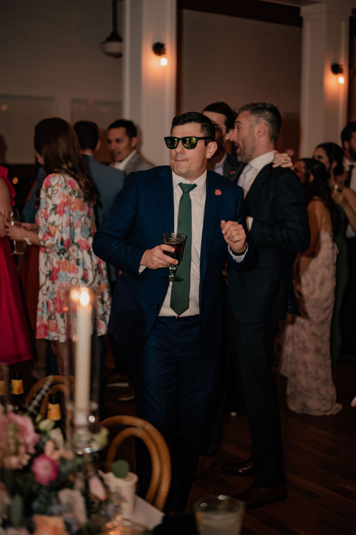 Energetic dance floor scene at wedding reception with guests in Dallas, Texas