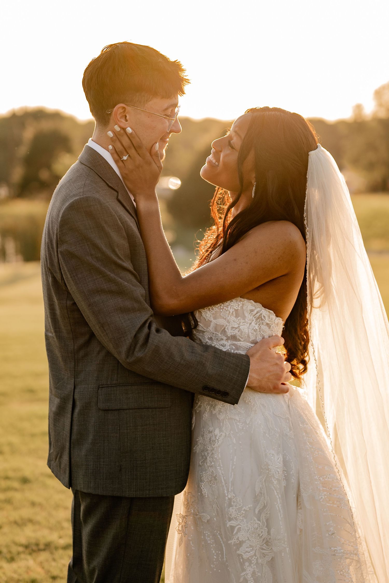 A romantic close up of wedding couple embracing during golden hour sunset in an outdoor field setting in Plano, Texas