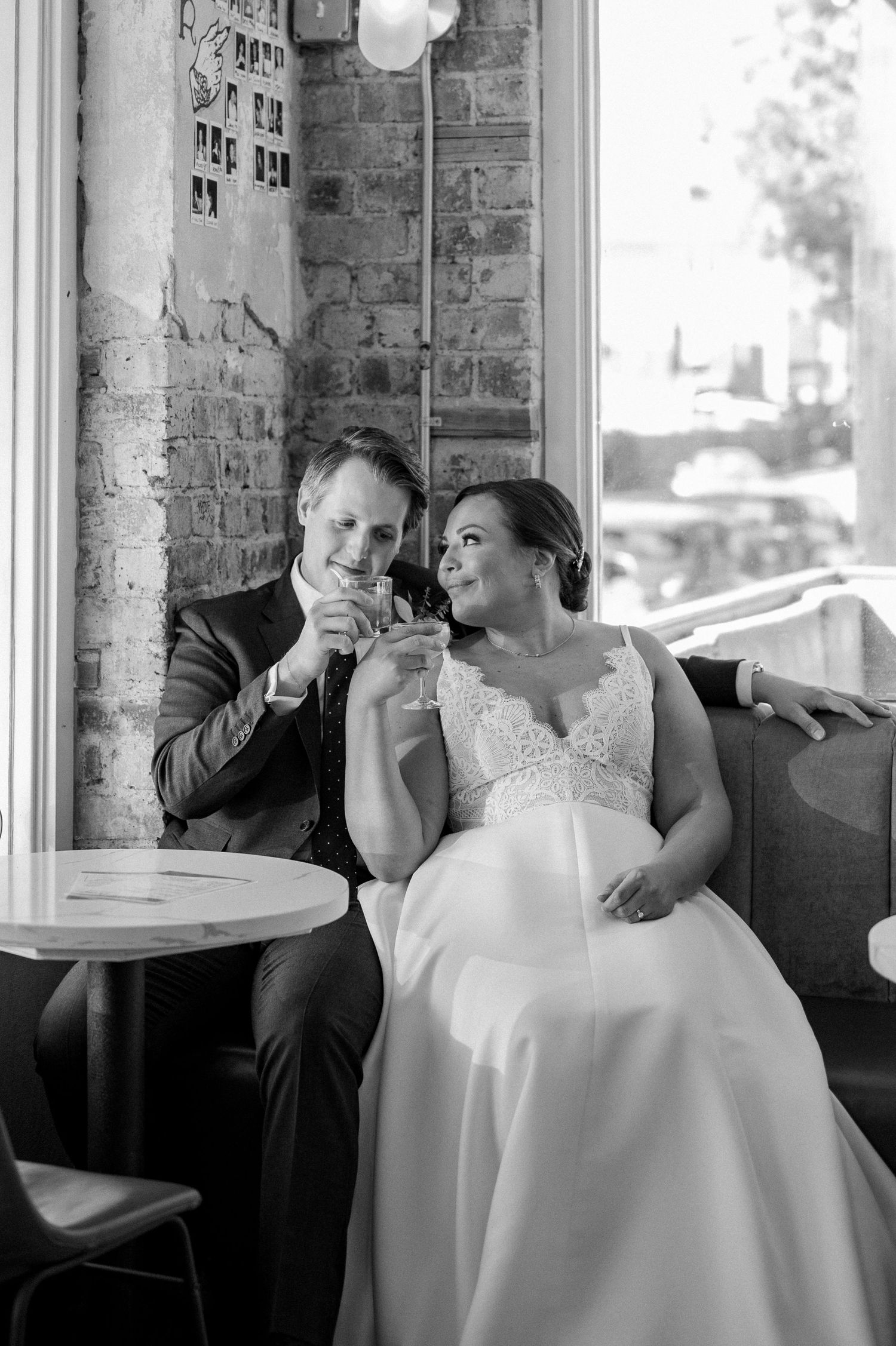 A couple shares drinks together at a cafe table in Bishop Arts bar in Dallas, TX