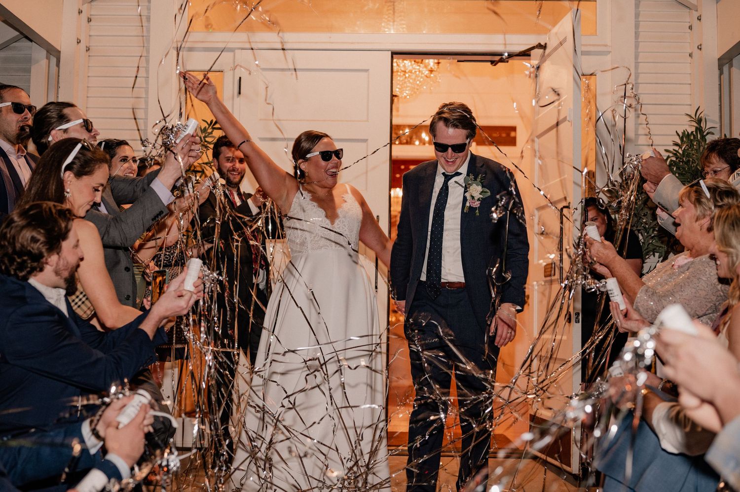 High energy wedding send-off photo of bride and groom leaving Cliffhouse wedding Venue in the Bishop Arts area of Dallas, Texas