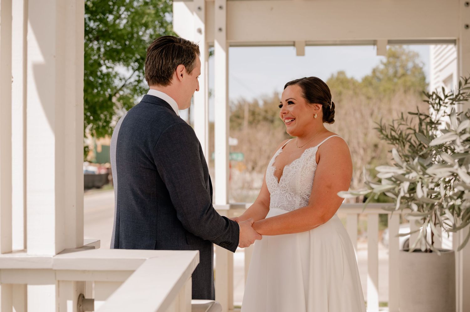 Candid first look sequence between bride and groom outdoors for their Spring wedding