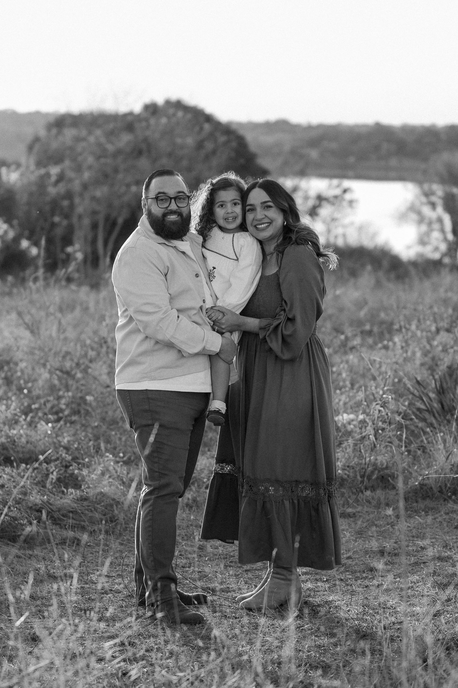 Black and white family photo overlooking the White Rock Lake in East Dallas, Texas