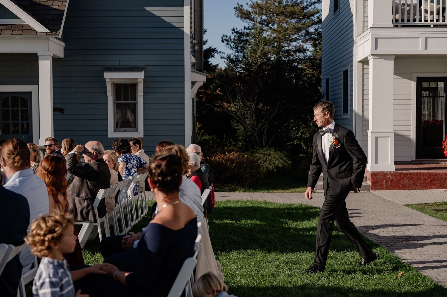 Documentary style candid of a groom walking down the aisle during the wedding ceremony in the Berkshires Massachusetts