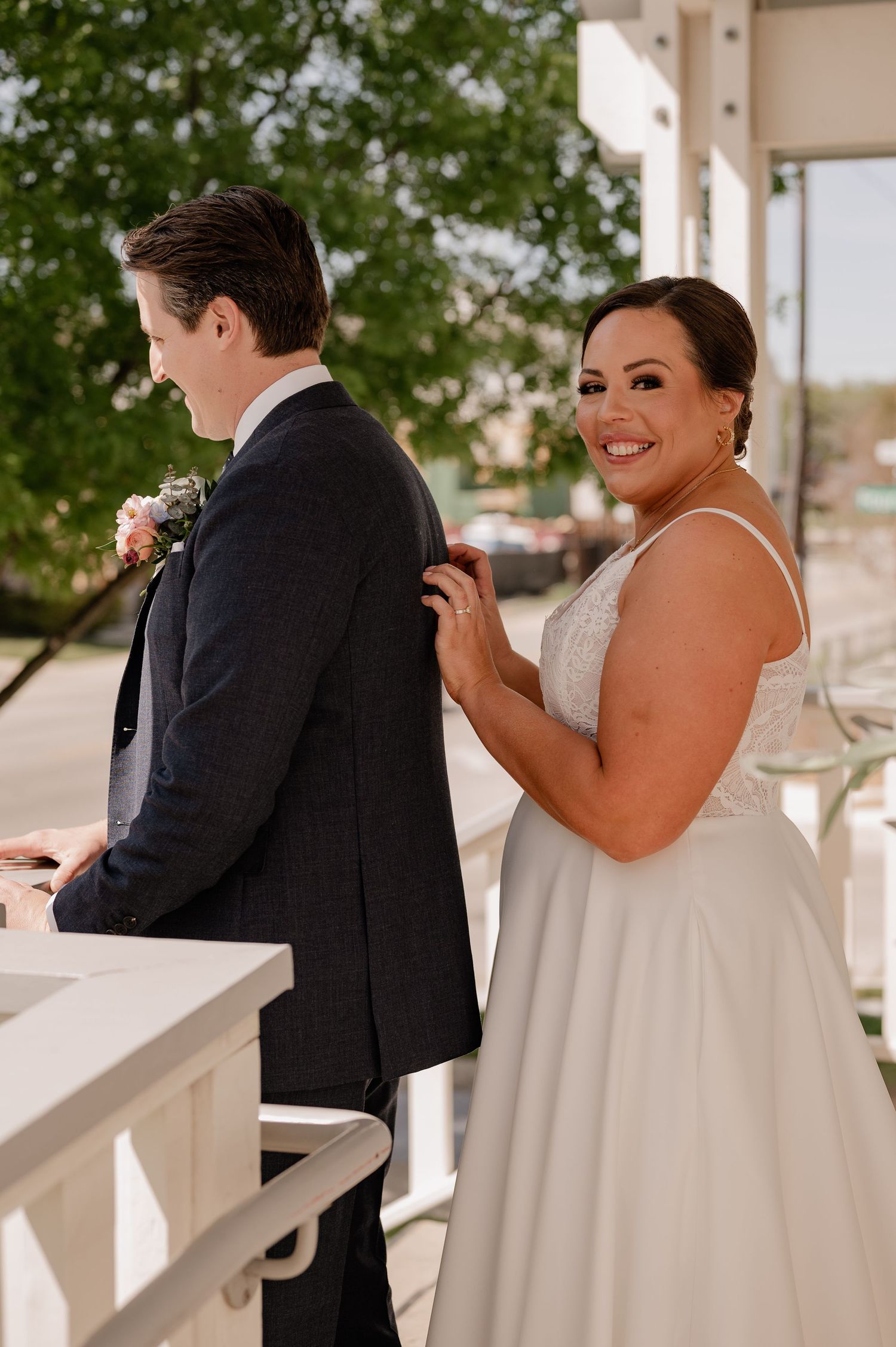 Candid moment of bride initiating the first look with her soon to be husband outdoors for their Spring wedding