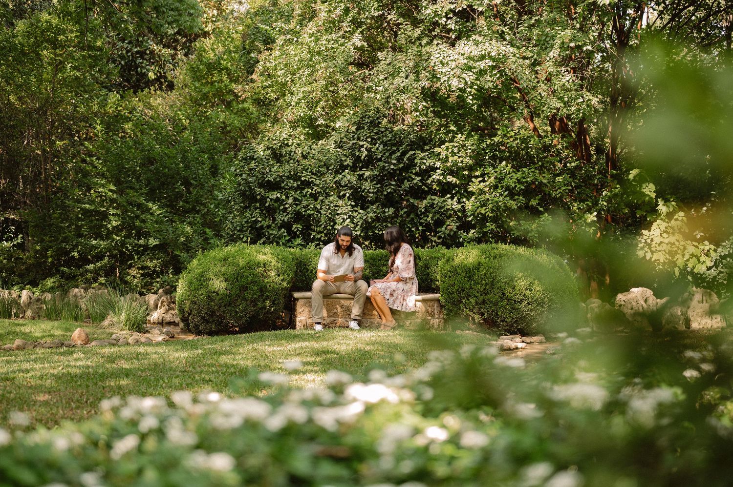 Couple during a surprise Spring wedding proposal at the Dallas Arboretum