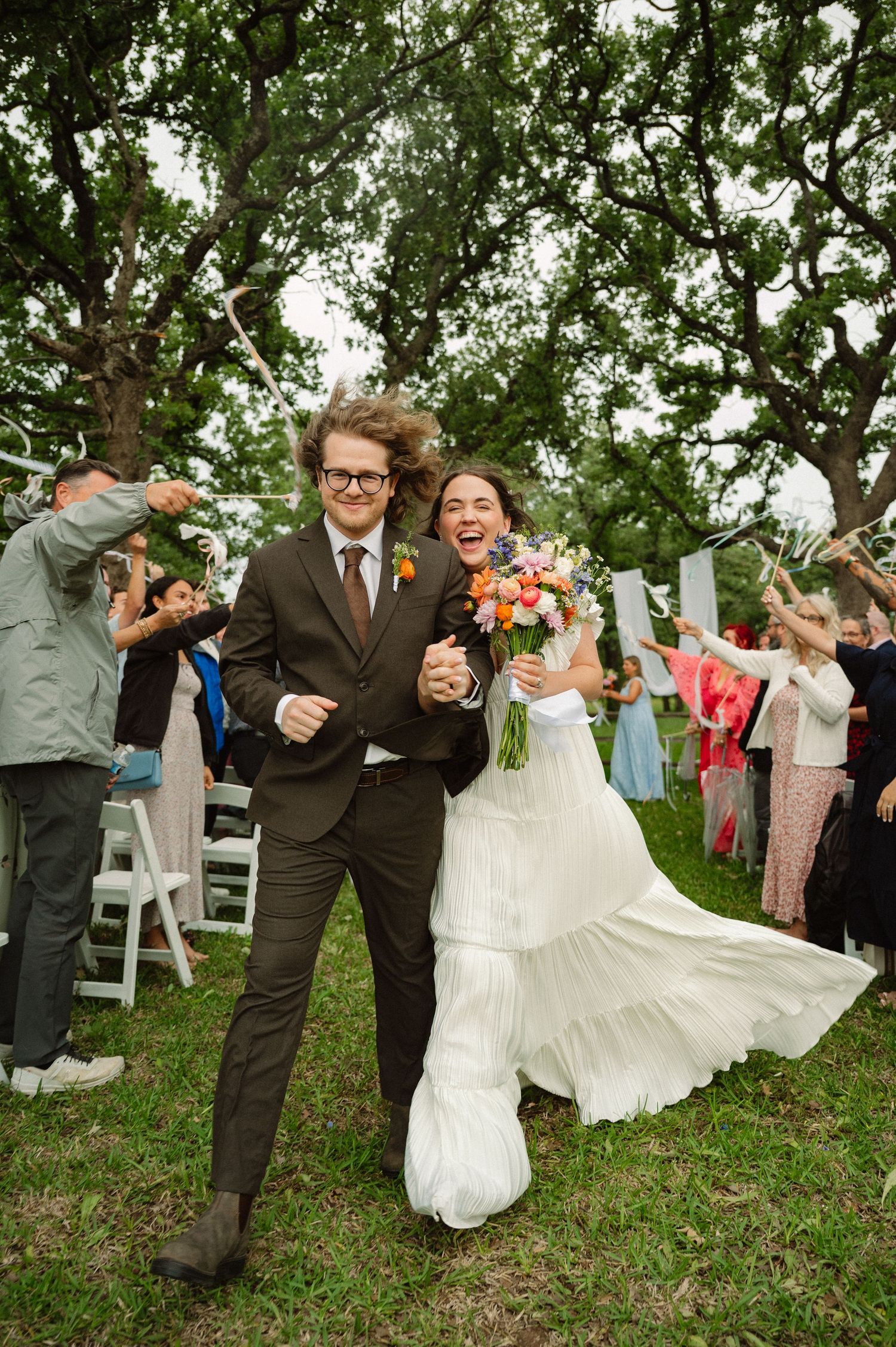 Vibrant Spring wedding ceremony exit of joyful couple in Dallas, Texas