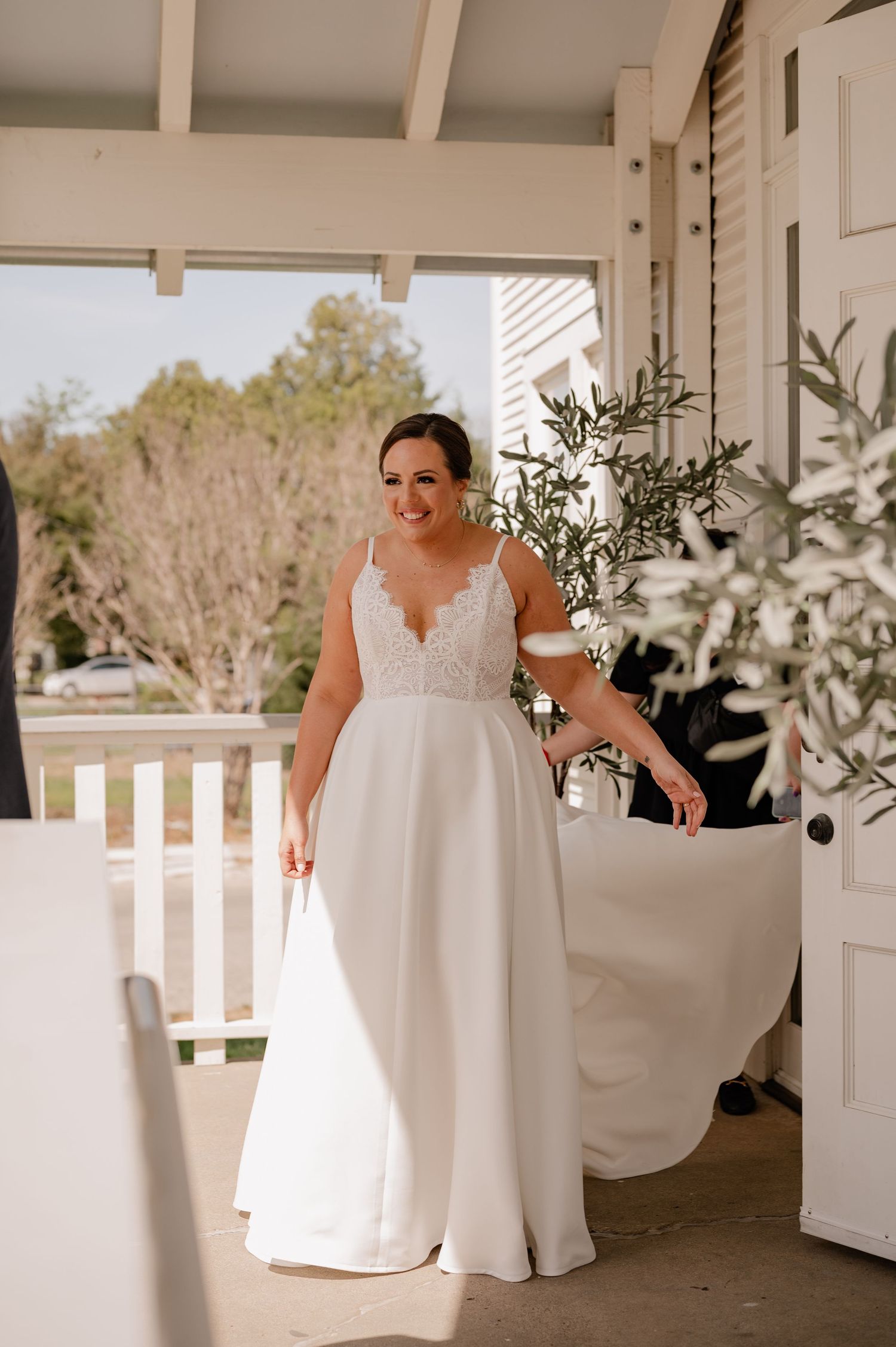 Candid moment of bride initiating the first look with her soon to be husband outdoors for their Spring wedding