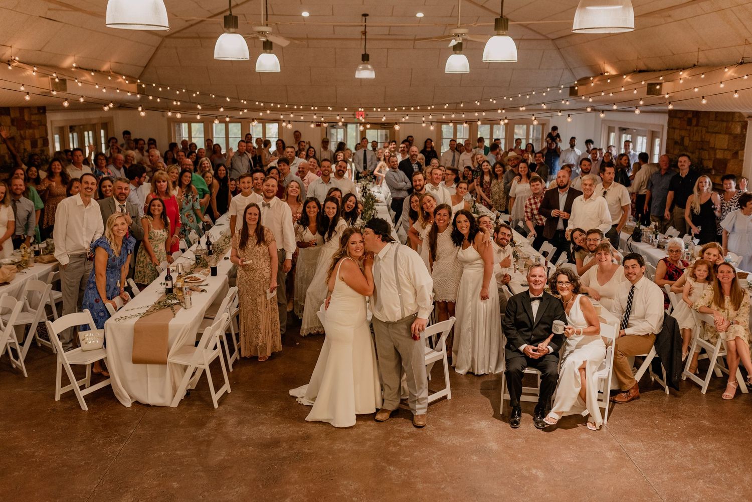 Wide shot of large wedding group full of family and guests for a summer wedding at Winfrey Point in Dallas, Texas