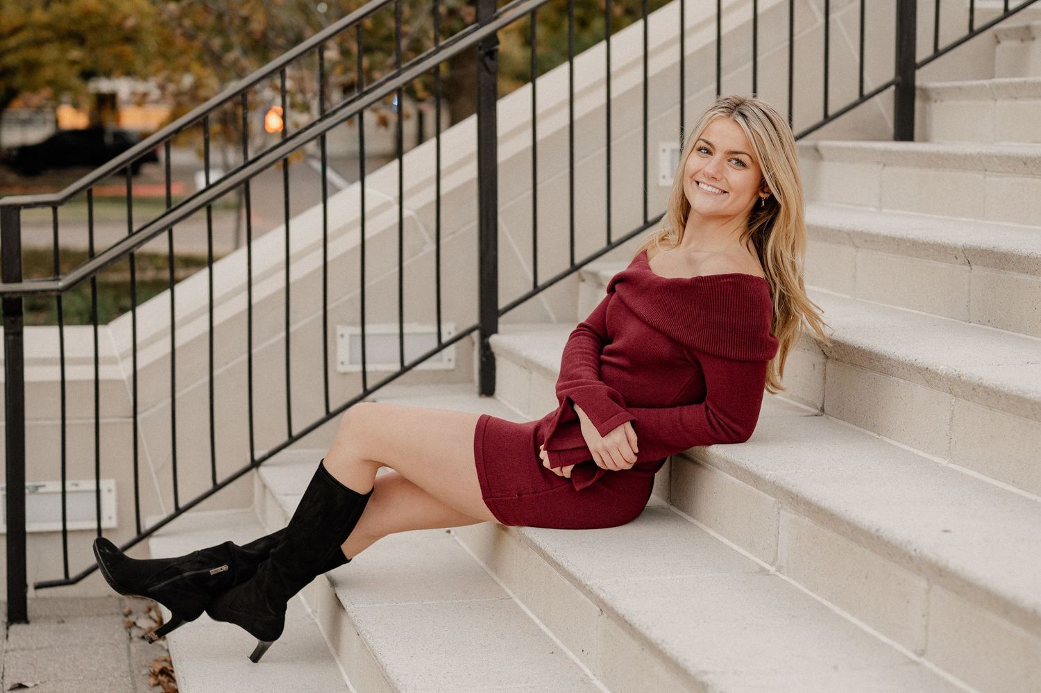 Senior girl posing on a staircase at Southern Methodist University for a fall senior photo session
