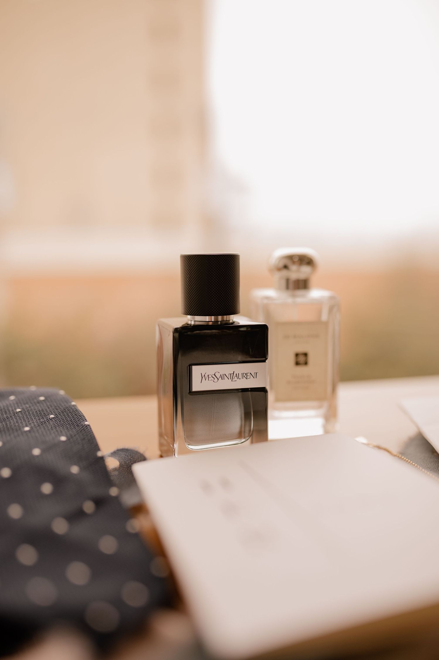 Elegant perfume bottles and accessories styled for wedding detail photography