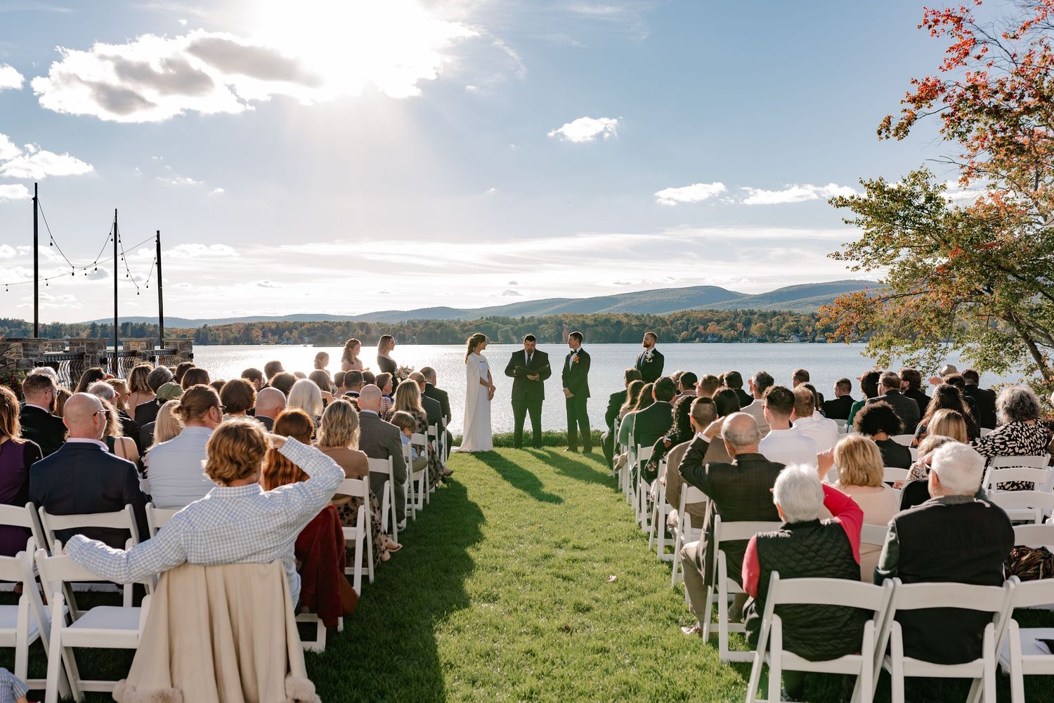 Documentary style candid of a bride and groom at the wedding ceremony over looking mountains and lake in the Berkshires Massachusetts
