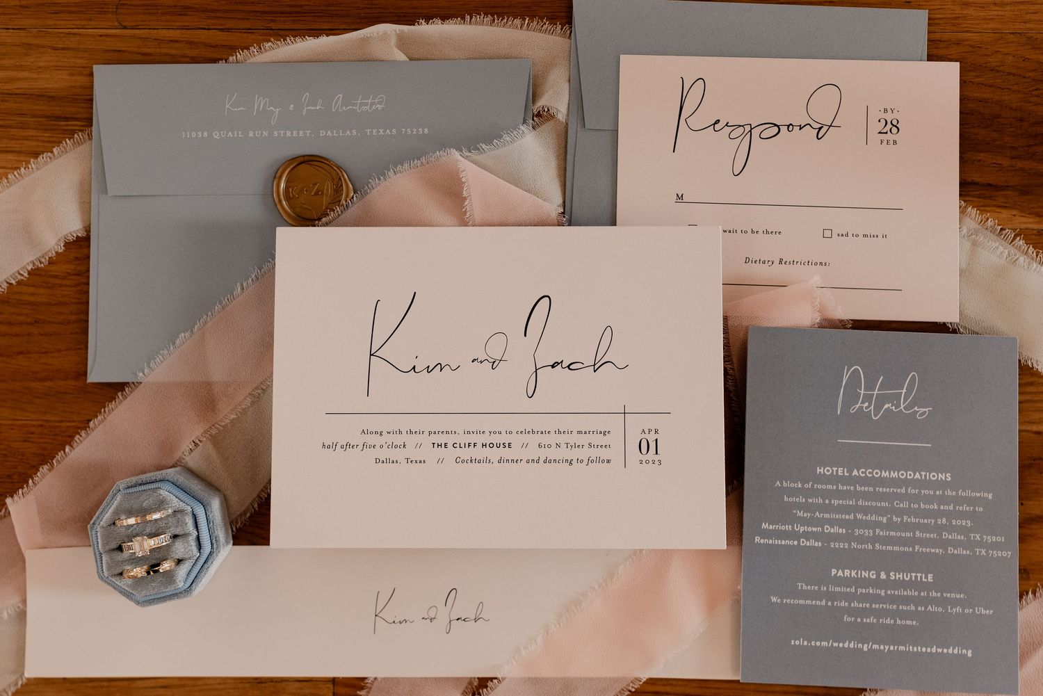 Elegant wedding invitation suite featuring minimalist calligraphy on white and blue cards with a pink ribbon accent