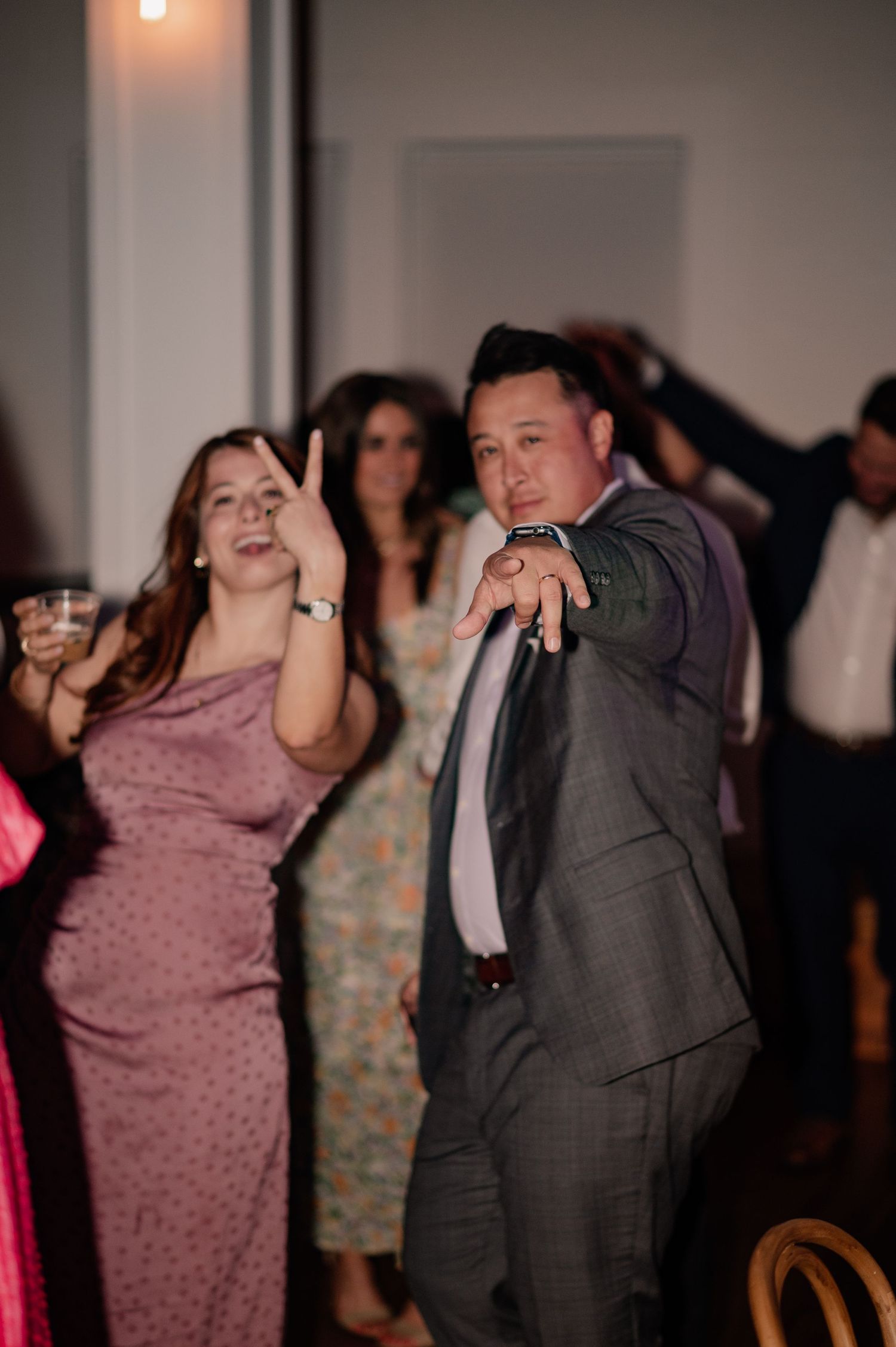 Wedding guests enthusiastically dancing at wedding reception in Dallas, Texas